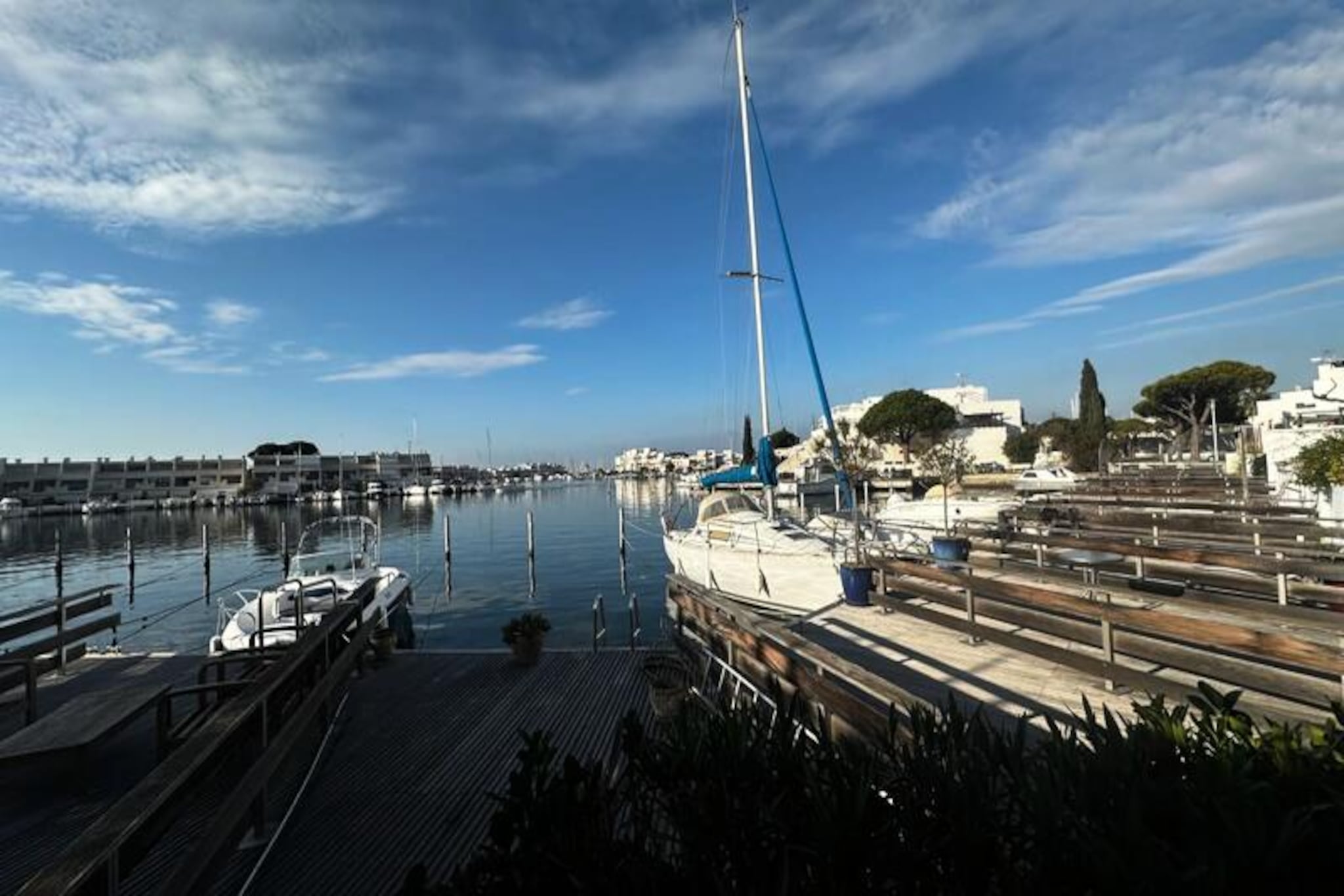 Where the sparkling waters of the Mediterranean meet the charm of Port Camargue, this spacious marina residence offers a serene escape for sea lovers and adventurers alike. Imagine sipping your morning coffee on the terrace as the gentle sea breeze carries the scent of salt and sunshine, or watching the golden hues of a sunset reflect on the tranquil waters. This is more than just a stay; it’s an invitation to immerse yourself in the beauty and rhythm of coastal life.
Step inside to discover a thoughtfully designed space that balances comfort and functionality. The accommodation features a cozy cabin with a bunk bed, a tranquil bedroom with a double bed, and a fully equipped kitchen where you can prepare fresh, local delicacies. The bright and airy living room opens directly onto the terrace, creating a seamless indoor-outdoor flow perfect for relaxation or entertaining. A private pontoon measuring 16m x 3.25m is the crown jewel of this property, offering the rare luxury of mooring your boat just steps from your door.
Located in the sought-after Port Camargue area, you’ll find yourself just moments away from sandy beaches, vibrant shops, and delightful restaurants. Whether you’re exploring the nearby nature reserves, indulging in fresh seafood, or simply soaking up the sun, this marina is your gateway to the best of the Camargue.
With its idyllic setting and unique amenities, this property promises an unforgettable retreat where every moment is infused with the magic of the Mediterranean.