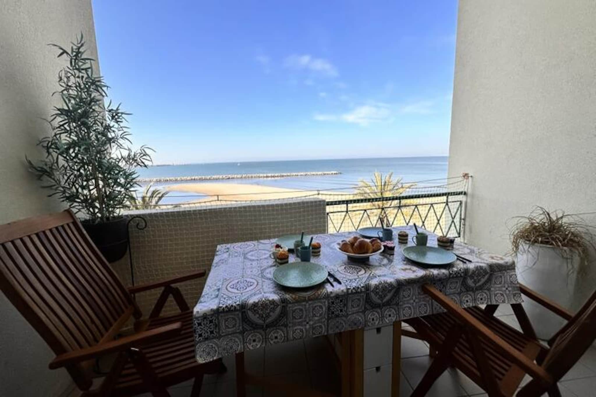 Wake up to the soothing sound of waves and the scent of sea air in this charming apartment overlooking the Mediterranean. Located in the heart of Le Grau-du-Roi's iconic Left Bank, this seaside retreat offers an authentic taste of life in a historic fishing village. Watch trawlers set sail at dawn and fishermen display their fresh catch at the bustling port, all just steps from your door. With panoramic sea views and the beach at your feet, this is the perfect place to unwind and immerse yourself in the rhythm of coastal living.
Designed for comfort and relaxation, the apartment accommodates up to four guests. It features two cozy bedrooms, including one with a luxurious 180cm bed and another with two 90cm beds that can be combined. The bright living room opens onto a sea-view terrace, ideal for enjoying your morning coffee or an evening aperitif. A fully equipped kitchen allows you to prepare meals with ease, while the modern bathroom with a walk-in shower adds a touch of luxury. Wi-Fi, TV, and thoughtful amenities ensure a seamless stay.
Step outside and find yourself surrounded by the vibrant life of Le Grau-du-Roi. The beach, shops, markets, and restaurants are all within a two-minute walk, while the town center and the renowned Seaquarium are just a short stroll away. Explore the natural beauty of the Camargue, with its wild horses, flamingos, and salt marshes, or take a day trip to nearby Montpellier. Whether you're here for a romantic getaway, a family vacation, or a business trip, this apartment offers a perfect blend of tradition, nature, and modern comfort.
With convenient access to public transport, including the Grau-du-Roi train station just 1 km away, and Montpellier Airport less than an hour's drive, your Mediterranean escape begins the moment you arrive. Let the gentle pace of Le Grau-du-Roi and the beauty of the sea create memories to last a lifetime.