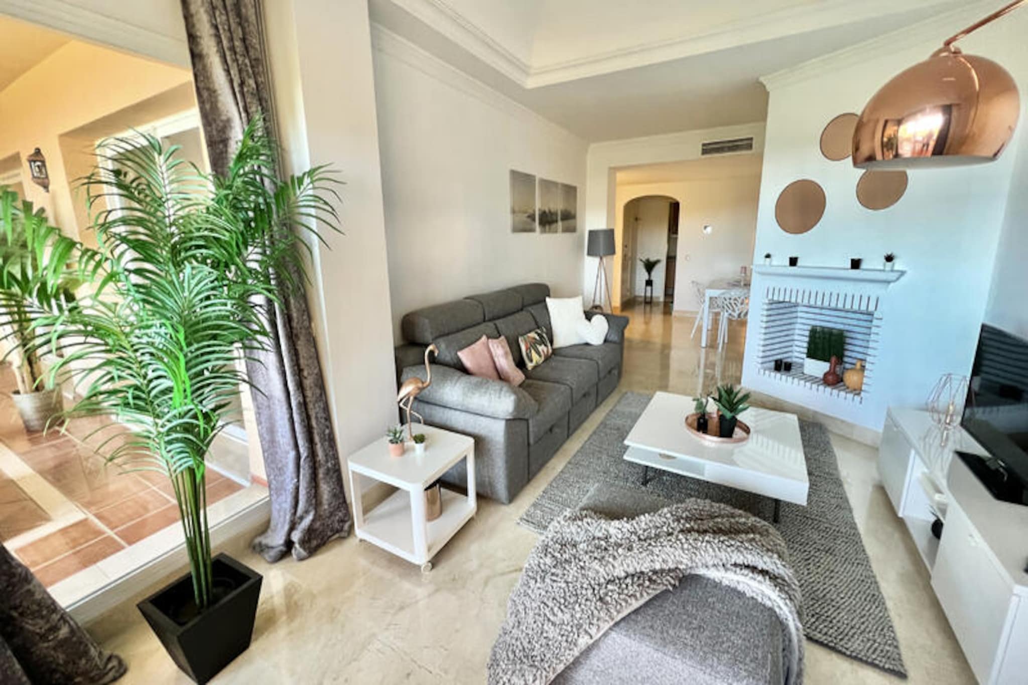 Perched in the serene hills of Elviria, this stunning apartment offers a tranquil escape with breathtaking views of the Mediterranean Sea, lush golf courses, and rolling hills. The peaceful ambiance is complemented by the vibrant colors of the surrounding tropical gardens, creating the perfect setting for a rejuvenating getaway. Whether you're seeking a relaxing retreat or an active holiday, this property caters to all your needs.
Inside, the apartment boasts two spacious bedrooms and two modern bathrooms, ensuring a comfortable stay for families or small groups. The interiors are tastefully decorated with a blend of elegance and warmth, while the fully equipped kitchen and open-plan living area make it easy to feel at home. Step out onto the large covered terrace to enjoy your morning coffee or an evening glass of wine as you soak in the stunning vistas. The development also features two sparkling swimming pools, inviting you to cool off under the Spanish sun.
Conveniently located just 2 km from the bustling commercial area of Elviria, you'll find supermarkets, charming restaurants, and vibrant bars within easy reach. The golden sands of Elviria Beach are also a short drive away, offering endless opportunities for sunbathing, water sports, or leisurely strolls along the shore. Golf enthusiasts will appreciate the proximity to the Santa Maria Golf Club, just a stone's throw from the property.
With its unbeatable location, luxurious amenities, and thoughtful touches like a welcome pack of essentials, this apartment is the ideal base for exploring the beauty of the Costa del Sol. Whether you're here to unwind or explore, unforgettable memories await in this Mediterranean haven.