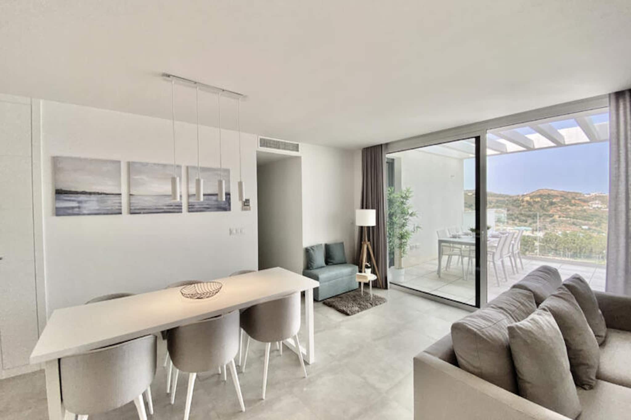 Imagine waking up to the gentle Mediterranean breeze and stepping onto your private terrace to soak in panoramic views of the Sierra de Mijas and the sparkling sea. This modern and elegant apartment is perfectly situated next to La Noria Golf and just 2km from the charming village of La Cala and its golden beaches. Whether you're a golf enthusiast or simply seeking a tranquil retreat, this brand-new residence offers the ideal blend of relaxation and recreation.
Inside, the apartment boasts a refined design with three spacious bedrooms and two bathrooms, including a luxurious master suite with a dressing room and en-suite bathroom. The open-plan living area flows seamlessly onto the main terrace, where a comfortable lounge and dining area await, perfect for al fresco meals or unwinding with a glass of wine. A second sunny terrace with sun loungers invites you to bask in the Andalusian sun in complete privacy.
The development itself is a haven of leisure, featuring three stunning outdoor swimming pools, a children’s play area, a gym with a small spa, a paddle tennis court, and a communal BBQ area for memorable evenings with family and friends. The Lidl supermarket is conveniently nearby, ensuring all your essentials are within easy reach.
Whether you're exploring the vibrant streets of La Cala, relaxing on the beach, or enjoying the on-site amenities, this property offers an unforgettable escape on the Costa del Sol. Book your stay and experience the perfect balance of comfort, luxury, and Andalusian charm.