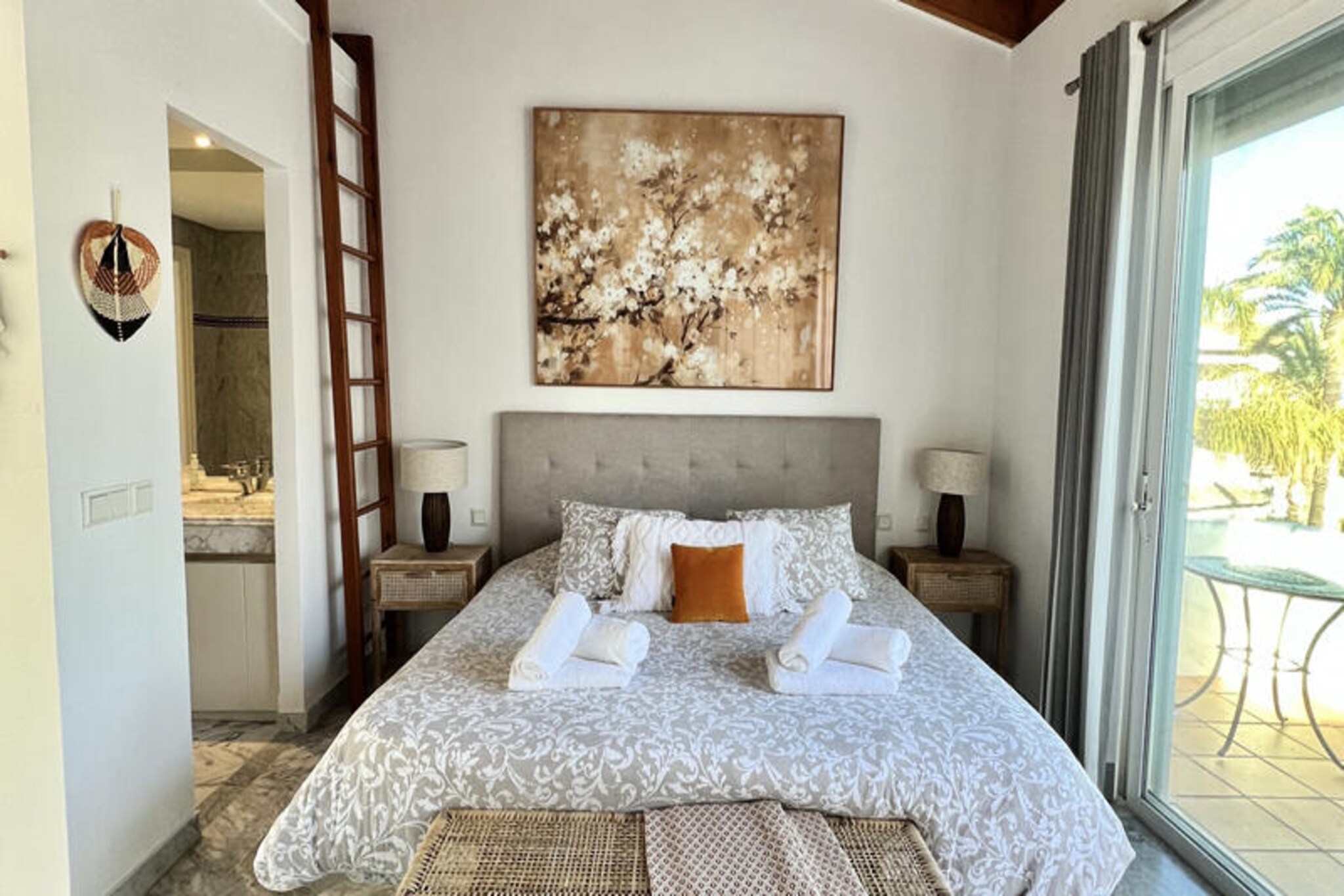 A few steps from the golden sands of the Costa del Sol, this beautifully redecorated terraced house offers a serene retreat for beach lovers and sun seekers alike. Imagine waking up to the gentle sound of waves, enjoying breakfast on your private terrace with stunning sea views, and strolling through lush tropical gardens to reach the beach just 30 meters away. This property combines modern comfort with a touch of ethnic charm, creating the perfect setting for unforgettable moments with family or friends. \n\nThe ground floor welcomes you with a spacious dining-living area that seamlessly connects to two terraces, a barbecue zone, and a private garden. From here, you have direct access to the shared pool and the beach beyond. The fully equipped kitchen opens onto the dining room, making it easy to prepare meals and enjoy them together. Upstairs, the first floor features two cozy bedrooms, one with a terrace overlooking the sea, and two bathrooms. The crowning jewel is the master suite on the top floor, boasting high ceilings, an en-suite bathroom, and a private terrace with panoramic sea views. \n\nThe complex offers a range of amenities, including tropical gardens, a children’s playground, and a large swimming pool surrounded by sun loungers. Whether you’re relaxing by the pool or exploring the nearby coastline, this home provides the ideal base for your holiday. Please note that one of the pools is closed from November to March, and regional water restrictions may affect pool availability during drought periods. \n\nWith its unbeatable location, stylish interiors, and direct beach access, this property is a true gem on the Costa del Sol. Whether you’re seeking tranquility or adventure, this house invites you to create lasting memories in one of Spain’s most picturesque destinations.