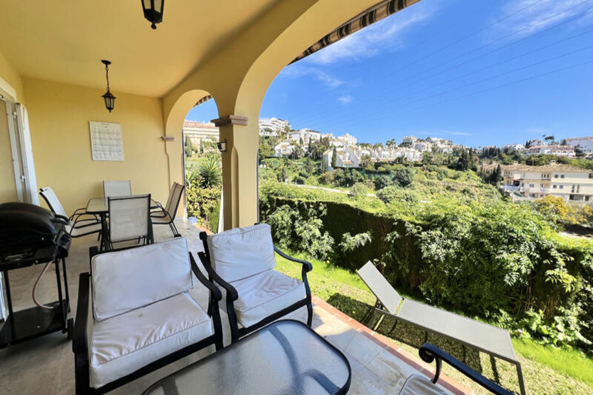 Basking in the warm Mediterranean sun, this delightful semi-detached house in the heart of Mijas Costa offers the perfect retreat for your next vacation. Imagine waking up to serene views of the golf course, its tranquil lake, and the sparkling sea, all from the comfort of your private terrace. Whether you're sipping your morning coffee or enjoying a barbecue on the gas grill, the covered terrace and communal garden provide a picturesque setting for relaxation and connection with nature. \n\nInside, the home is thoughtfully designed to cater to your every need. The ground floor features a cozy living room that opens onto the terrace, a fully equipped kitchen for preparing delicious meals, a convenient laundry room, and a guest toilet. Upstairs, you'll find three spacious bedrooms with ample storage, one boasting an en-suite bathroom, while the other two share a modern bathroom. For an added touch of luxury, the rooftop terrace offers even more breathtaking views, making it the perfect spot to unwind after a day of exploring. \n\nThe property is part of a small residential complex with access to a communal swimming pool surrounded by sun loungers, ideal for soaking up the Costa del Sol sunshine. Just a 4-minute drive away, La Cala de Mijas awaits with its stunning beaches, vibrant restaurants, and lively bars. Golf enthusiasts will appreciate the proximity to Miraflores Golf Course and Sports Club, just a 10-minute walk away. For a taste of local charm, visit Mijas Pueblo, a picturesque whitewashed village known for its donkey taxis, or explore the nearby town of Fuengirola with its Bioparc animal park and historic Sohail Castle. \n\nWith Malaga Airport just 30 minutes away, this charming home is your gateway to unforgettable memories on the Costa del Sol. Whether you're seeking adventure, relaxation, or a mix of both, this property offers it all.