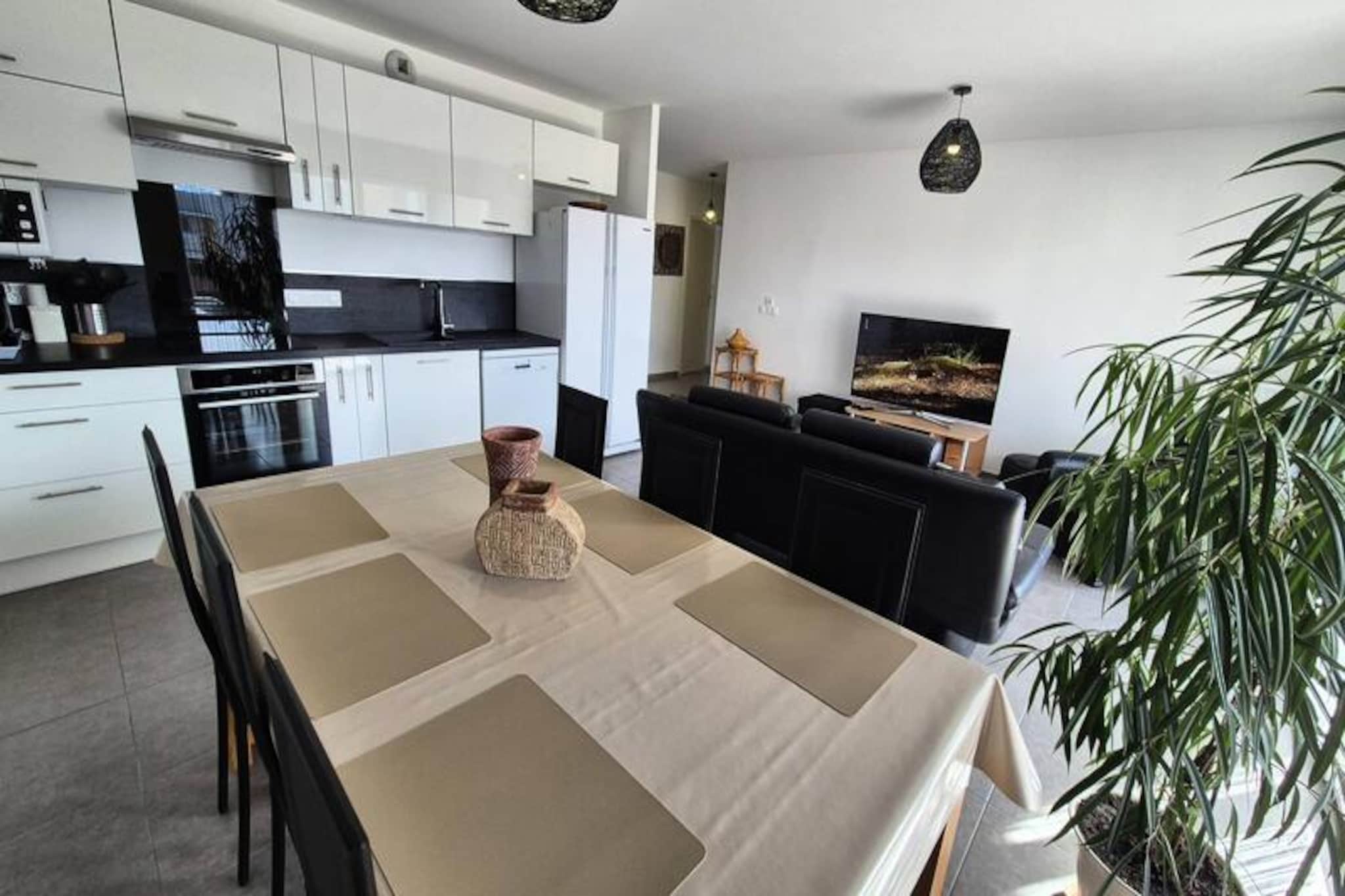 In the serene town of Aix-les-Bains, where the charm of the lake meets the majesty of the mountains, this modern residence offers a perfect blend of tranquility and convenience. Situated just a short drive from the vibrant town center and the picturesque lakeside, it invites you to experience the best of both worlds—nature and urban life. Whether you're seeking a peaceful retreat or an active getaway, this location caters to every mood and moment. Imagine starting your day with a stroll through the nearby Corsuet Forest or enjoying the therapeutic benefits of the renowned Chevalley Thermal Baths, only minutes away. \n\nThis spacious, meticulously designed 81m² apartment is a haven of comfort and style. Located on the first floor of a prestigious building, it features dual-aspect views and a thoughtful layout that accommodates up to four guests. The open-plan living area, complete with a cozy sofa, armchair, and flat-screen TV, flows seamlessly into a fully equipped kitchen boasting modern appliances like an induction hob, oven, microwave, and dishwasher. Two elegantly furnished bedrooms offer restful retreats, with ample storage and tasteful decor. The bathroom, equipped with a bathtub and heated towel rail, ensures relaxation after a day of exploration. Additional amenities include fiber optic internet, an elliptical trainer, and private parking with electric bike charging facilities. \n\nThe residence’s prime location places you within easy reach of Aix-les-Bains’ cultural and natural treasures. Stroll along the lakeside promenade, explore Mont Revard’s breathtaking vistas, or indulge in local delicacies at nearby bakeries and restaurants. With a pharmacy and bus stop just steps away, convenience is at your doorstep. Whether you’re drawn to the therapeutic waters, scenic trails, or charming town atmosphere, this apartment is your gateway to unforgettable experiences. \n\nChoose this elegant retreat for a holiday that combines relaxation, adventure, and the timeless beauty of the French Alps.
