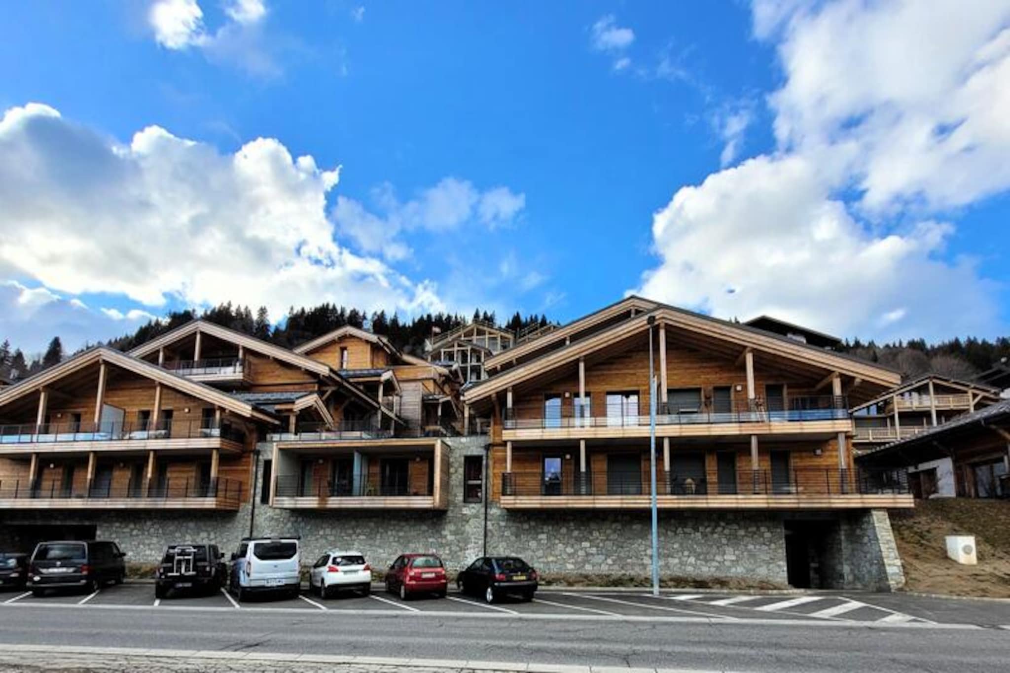 In the heart of the charming French Alps, this modern apartment in the La Croisette residence offers a perfect blend of comfort and convenience. Completed in 2024, the residence is ideally located just 300 meters from the town center and steps away from the lively market square. With its south-east exposure, the apartment is bathed in natural light throughout the day, creating a warm and inviting atmosphere for your alpine getaway. Whether you're here to ski the nearby slopes or simply relax, this residence promises a memorable stay. \n\nThe apartment spans 64 m² and is thoughtfully designed to accommodate up to six guests, with an ideal capacity for four. The living room is bright and spacious, featuring a fully equipped kitchen, dining area, and a cozy lounge with a TV. French doors lead to a generous 30 m² terrace, perfect for enjoying your morning coffee or unwinding after a day of adventure. The master bedroom boasts a comfortable double bed, TV, and direct access to the terrace, while the second bedroom offers two single beds that can be combined. Additional sleeping arrangements include a sofa bed in the living area. Two modern shower rooms ensure convenience for all guests. \n\nLocated just 600 meters from the nearest ski slopes and 700 meters from the French Ski School, this residence is a haven for winter sports enthusiasts. In summer, the region transforms into a paradise for hikers and nature lovers, with scenic trails and breathtaking views. Essential amenities such as shops, shuttles, and medical services are all within walking distance, making your stay stress-free and enjoyable. \n\nWhether you're seeking adventure or tranquility, this apartment is your gateway to the best of the French Alps. With high-quality facilities, thoughtful services, and a prime location, it’s the perfect choice for your next holiday.