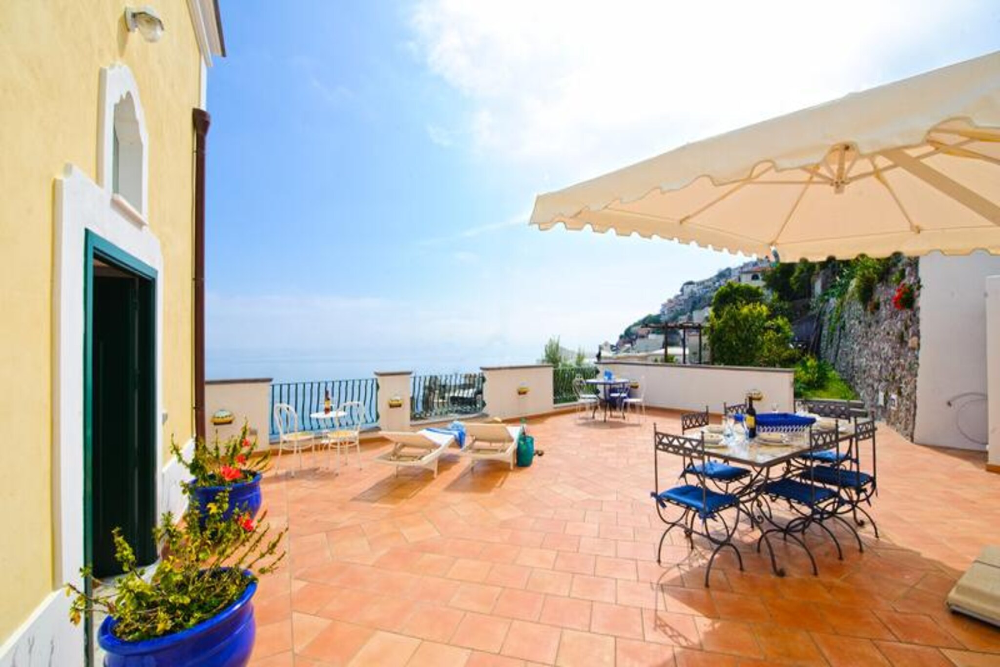 Perched on the eastern slope of Praiano, Casa Alessia offers an unparalleled retreat with panoramic sea views that will leave you breathless. This charming villa, nestled along the iconic Amalfi Coast, seamlessly blends traditional coastal elegance with modern comforts. Recently renovated, its bright interiors feature hand-painted tiles and sophisticated details that reflect the region’s timeless beauty. Accessible via approximately 50 steps from the main road, the villa ensures both convenience and tranquility, providing a private haven just steps away from local shops, restaurants, and cafes. Whether you’re savoring a meal under the stars or basking in the Mediterranean sun, the terraces of Casa Alessia promise unforgettable moments of relaxation.  
    Spread across two independent floors, the villa is perfect for couples, families, or small groups. The first floor boasts a spacious terrace with sun loungers and an outdoor dining table, a fully equipped kitchen, a large living room with a sofa bed, two double bedrooms with private bathrooms, and a laundry room. The second floor, connected by private external steps, features another terrace with a barbecue, a cozy living room with a fireplace, a kitchen, and two bedrooms with sea views, one with twin beds and a private bathroom. Modern amenities such as WiFi, air conditioning, and dishwashers ensure a comfortable stay.  
    Casa Alessia’s location is ideal for exploring the wonders of the Amalfi Coast. A 20-minute walk leads to La Praia beach, renowned for its seafood restaurants, while Positano and Amalfi are just a short drive away. With nearby bus stops, grocery stores, and parking options, this villa offers the perfect blend of convenience and serenity. Immerse yourself in the magic of Praiano and create memories that will last a lifetime.