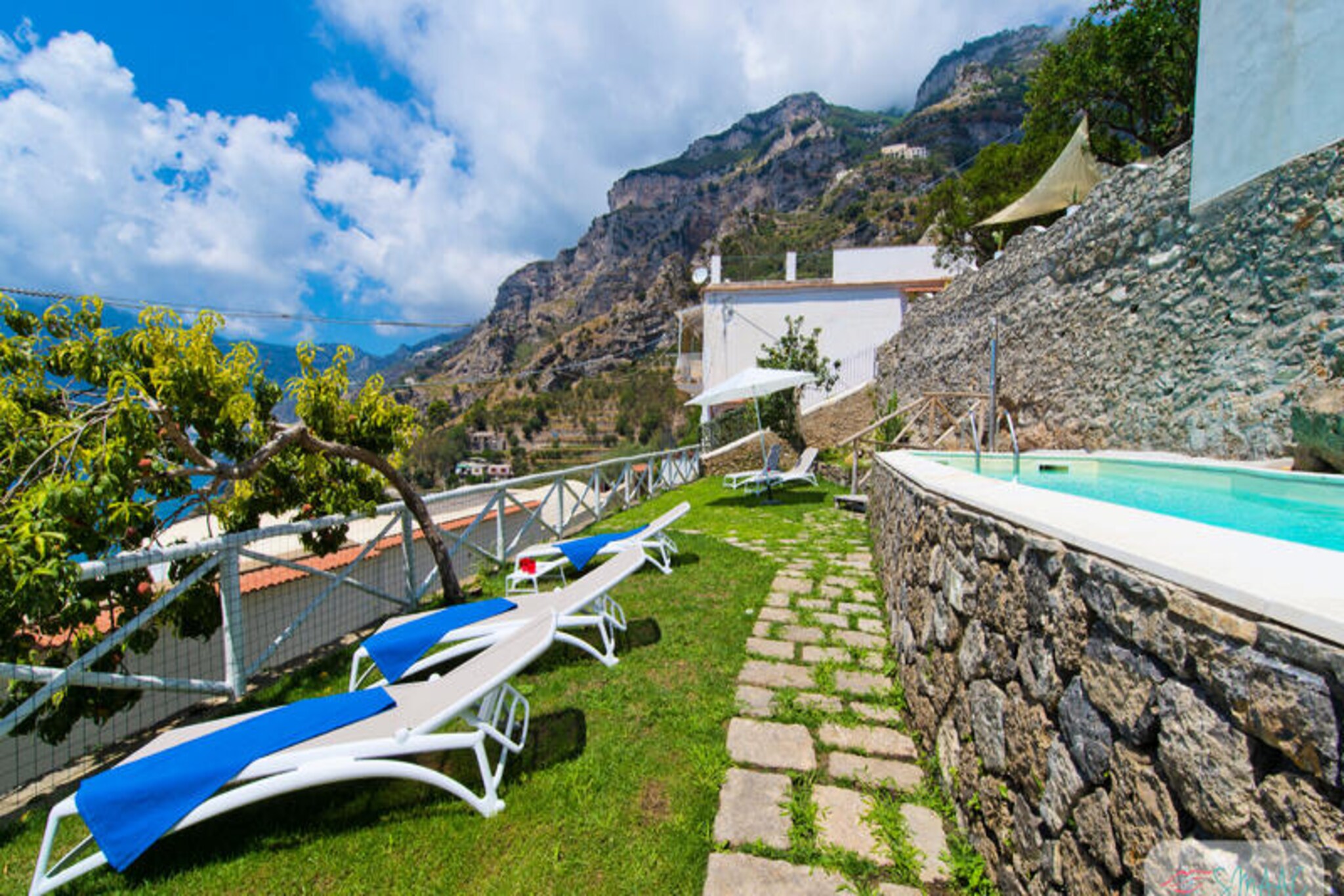 Perched on the stunning Amalfi Coast, Villa Imperati invites you to immerse yourself in a world of elegance and tranquility. With breathtaking views stretching across the azure waters to Positano and Capri, this recently renovated villa offers a perfect blend of modern comfort and timeless charm. Imagine sipping your morning coffee as the sun rises over the sea or unwinding by the private pool as the golden hues of sunset paint the sky. This is your sanctuary in Praiano, where every moment feels like a dream. \n\nSpread across two spacious floors, the villa is designed to cater to your every need. The ground floor features a lush garden with a sparkling private pool, an outdoor heated shower, sun loungers, and a barbecue area for al fresco dining. Step inside to find a cozy living room with a dining area, a fully equipped kitchen, a double bedroom, a single bedroom with an optional extra bed, and two modern bathrooms with showers. Upstairs, the master bedroom boasts a private terrace with sun loungers and a jacuzzi bathroom with panoramic sea views, offering a luxurious retreat after a day of exploration.\n\nVilla Imperati’s location is as enchanting as the property itself. Nestled in a peaceful area of Praiano, it’s accessible via a charming path with steps, ensuring a serene escape from the bustling world. Within walking distance, you’ll find the famous Path of the Gods, local restaurants, a grocery store, and the vibrant One Fire Beach Club. For those seeking adventure, the villa is perfectly positioned to explore the wonders of the Amalfi Coast.\n\nWhether you’re lounging by the pool, savoring local delicacies, or exploring nearby trails, Villa Imperati promises an unforgettable Italian getaway. Let the beauty of the Amalfi Coast captivate your heart and create memories that will last a lifetime.