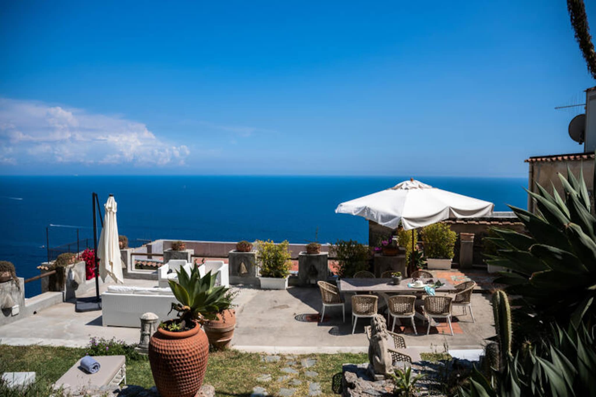 Perched in the heart of Praiano’s charming pedestrian area, Villa Panorama offers a serene escape with breathtaking views of the Amalfi Coast. This meticulously restored villa combines timeless elegance with modern luxury, making it an ideal retreat for travelers seeking both relaxation and adventure. Surrounded by a lush landscaped garden and featuring a spacious solarium, the villa invites you to unwind under the Mediterranean sun while soaking in the tranquil beauty of the region. Whether you’re enjoying a leisurely breakfast or a sunset aperitivo, the panoramic terraces provide unforgettable moments of serenity.  
                      The villa spans three levels, offering versatile accommodations to suit families or groups. The main complex boasts a bright living room with sea views, a fully equipped kitchen leading to the garden, and a sauna for ultimate relaxation. The first floor features a double bedroom and a bathroom with a shower, while the second floor includes a twin bedroom connected to a double room, both with access to a sea-view terrace. The annex, accessible from the garden, provides additional privacy with a living room, a double bedroom, and two bathrooms. Air conditioning in every room ensures comfort year-round, while daily cleaning services and optional breakfast add a touch of indulgence.  
                      Within walking distance, you’ll find local gems such as La Moressa, Kasai, and M’ama restaurants, as well as the convenient Tutto per Tutti supermarket. The picturesque Marina di Praia beach is just a 20-minute stroll away, or a short ride on the local bus. For those exploring further afield, private parking is available nearby for added convenience. Villa Panorama is more than a place to stay; it’s a gateway to the enchanting Amalfi Coast, where every corner reveals a new story and every moment becomes a cherished memory.