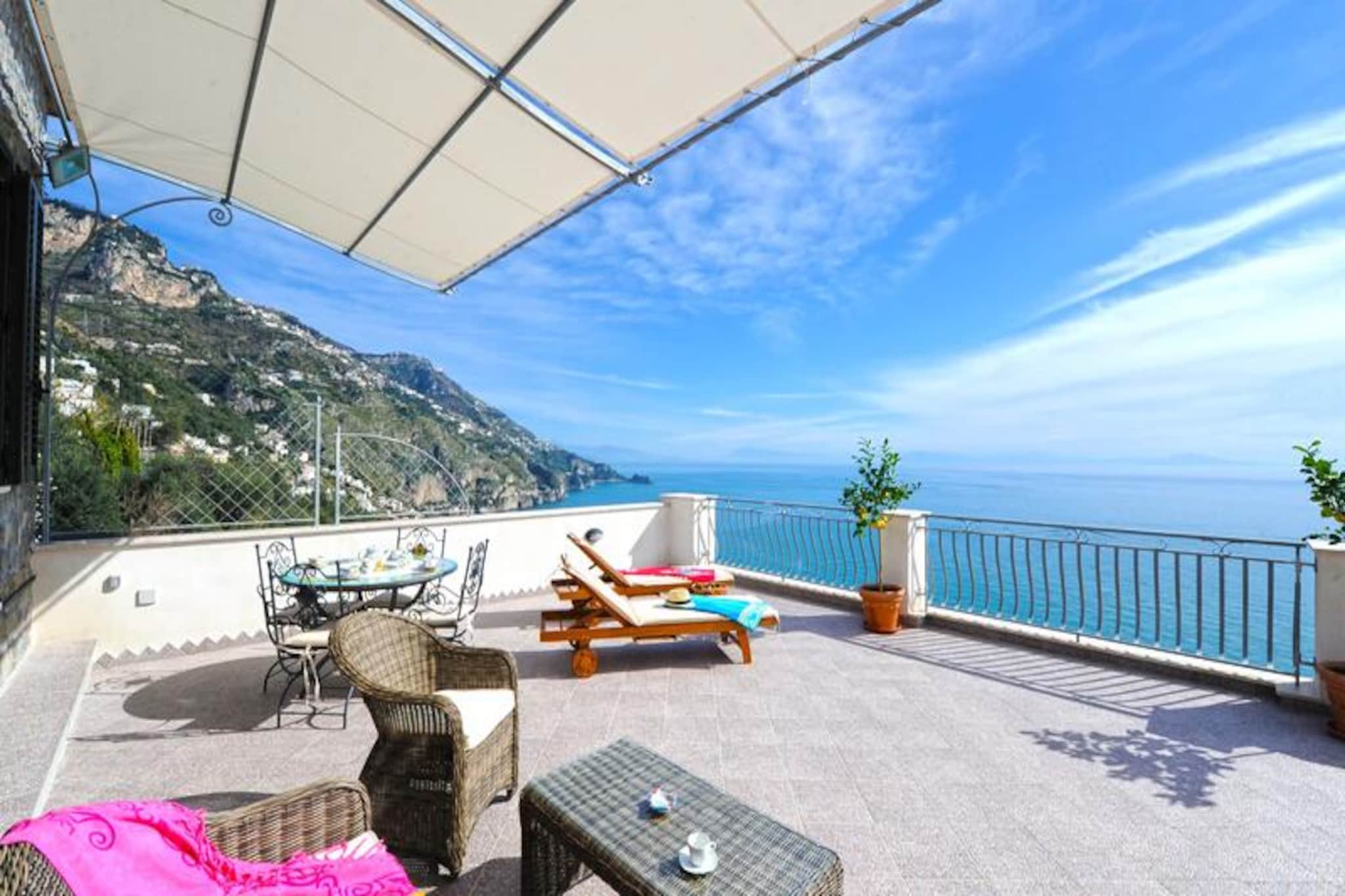 Perched above the shimmering waters of the Amalfi Coast, Casa Ulivella offers a serene retreat where timeless Italian charm meets modern comfort. Imagine waking up to the gentle sound of waves and stepping onto a spacious terrace that opens to breathtaking sea views. This recently renovated property is a haven for relaxation, with its sun-drenched terrace equipped with garden furniture, sun loungers, a barbecue, and an outdoor dining table for four. Whether you're sipping a morning espresso or enjoying a sunset dinner, every moment here feels like a postcard come to life. \n\nThe house is thoughtfully designed on a single floor, ensuring ease and comfort. The double bedroom, featuring a cozy bed (160x190), has direct access to the panoramic terrace, inviting you to soak in the coastal beauty from the moment you wake. The living room, with its double sofa bed and dining table, seamlessly connects to the fully equipped kitchen, making it perfect for couples or small families. A modern bathroom with a shower and a convenient laundry room complete the layout, ensuring all your needs are met during your stay. \n\nLocated in the heart of Praiano, Casa Ulivella is just 15 steps from the main road, offering both accessibility and privacy. Within walking distance, you'll find charming local restaurants, a grocery store, and bus stops, making it easy to explore the enchanting Amalfi Coast. For beach lovers, the main beach, La Praia, is just a 20-minute stroll away, where you can bask in the Mediterranean sun or enjoy a refreshing swim. \n\nWhether you're seeking a romantic getaway or a peaceful escape, Casa Ulivella promises an unforgettable experience, blending the allure of the Amalfi Coast with the comforts of home. Let the beauty of Italy captivate you as you create memories to last a lifetime.
