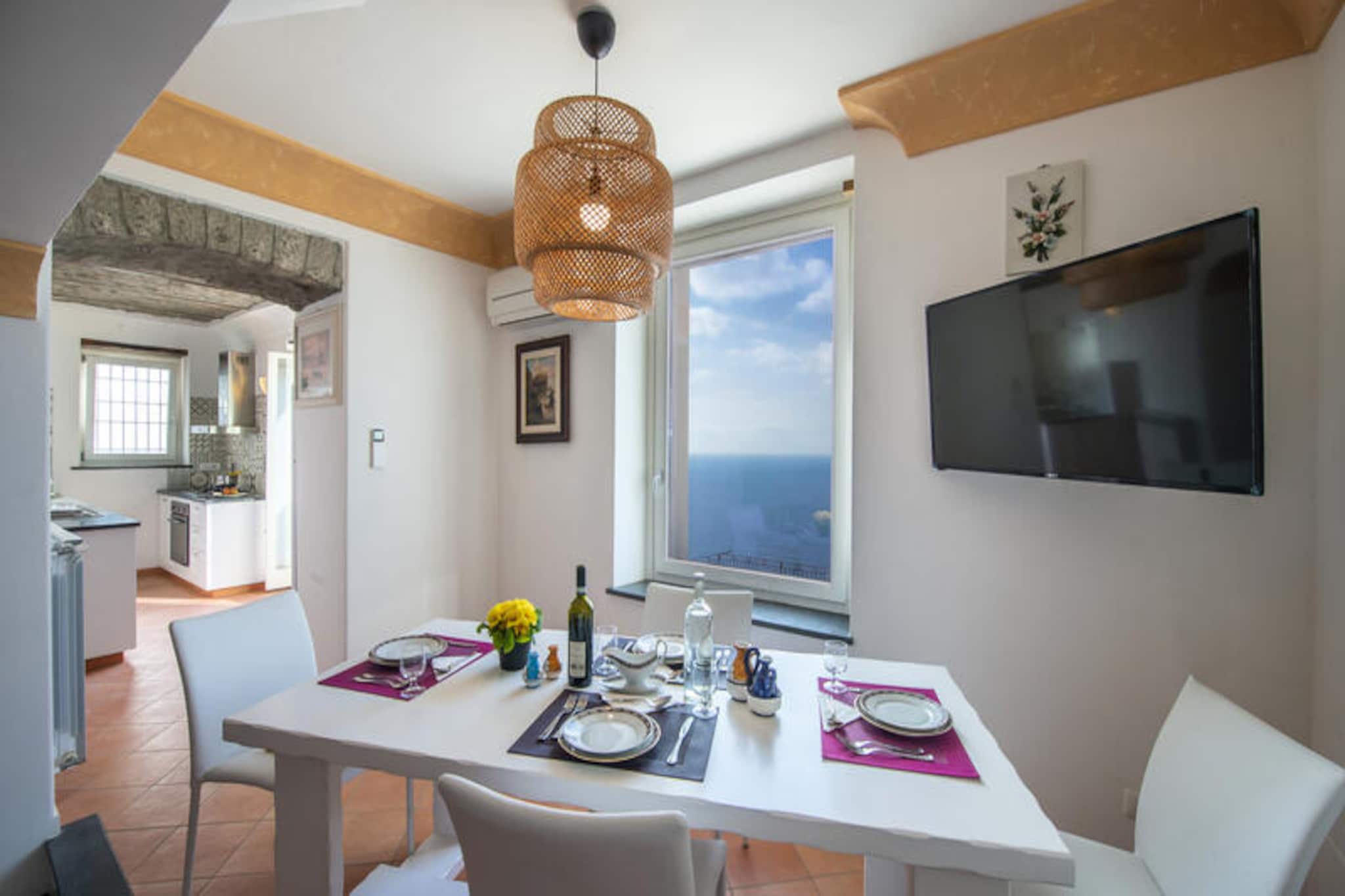 Perched on the western slope of Praiano, Villa Imperati offers a mesmerizing retreat with panoramic views stretching across Positano and Capri. This recently renovated villa combines modern elegance with the charm of the Amalfi Coast, creating a serene haven for travelers seeking beauty and tranquility. Imagine evenings spent watching the sun dip into the horizon from your private outdoor pool, surrounded by lush gardens equipped with sun loungers, an outdoor shower, and a barbecue area perfect for al fresco dining. The villa’s unique location, accessible only via a picturesque pedestrian path and staircase, immerses guests in the authentic atmosphere of this enchanting village. \n\nSpread across two floors, the villa boasts spacious interiors designed for comfort and relaxation. On the ground floor, a bright living room opens directly onto the garden, while the fully equipped kitchen invites culinary creativity. The bedrooms offer private access to the garden, including a double room and a flexible single room. Upstairs, the master bedroom features a private terrace with breathtaking sea views, complemented by a luxurious bathroom with a jacuzzi overlooking the coastline. Every detail has been thoughtfully curated to ensure an unforgettable stay. \n\nWithin walking distance, you’ll find charming local amenities such as bars, restaurants, and a small grocery store. For beach lovers, the One Fire Beach Club is just a 20-minute stroll away, while public transport options, including local and Sita buses, are conveniently located nearby. Please note that the villa’s layout and access may not be suitable for guests with reduced mobility, but its unique setting promises an unparalleled experience of Praiano’s timeless beauty. Whether you’re exploring the Amalfi Coast or simply unwinding by the pool, Villa Imperati is the perfect choice for a dream getaway.