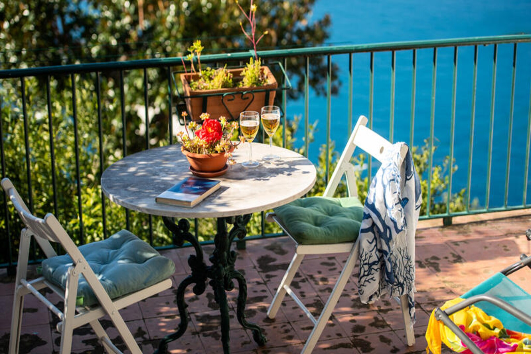 Perched above the sparkling Tyrrhenian Sea, Casa Nostra is a haven of serenity where the charm of the Amalfi Coast meets timeless elegance. Surrounded by lush gardens and a fragrant lemon tree, this enchanting retreat invites you to unwind in harmony with nature. From the expansive terrace, each sunset paints the sky in golden hues, offering breathtaking views of the sea, the Li Galli islands, and the iconic Positano on the horizon. This is not just a house but a cherished family legacy, where love and hospitality have been nurtured for generations, now shared with you to create your own unforgettable memories. \n\nThe house is thoughtfully designed across two levels to ensure maximum comfort. The ground floor features a spacious garden terrace, the heart of the home, perfect for al fresco dining or simply soaking in the panoramic views. Inside, the open-plan living and dining area is a cozy space to relax, while the fully equipped kitchen invites you to prepare meals with fresh herbs and lemons from the garden. Upstairs, accessible via an external staircase, are two bright and airy bedrooms, each with large windows framing the stunning sea views. A modern bathroom completes the upper floor, offering a refreshing retreat after a day of exploration.\n\nWhile Casa Nostra feels like a secluded paradise, it is ideally located to explore the wonders of the Amalfi Coast. Just a short drive away, you can immerse yourself in the vibrant charm of Positano, the historic allure of Amalfi, and the cultural treasures of Ravello. The nearby beaches and coastal trails offer endless opportunities for adventure and relaxation. \n\nPlease note that reaching the house requires a 300-meter path with steps, making it best suited for guests in good physical condition. However, the tranquility, views, and authentic charm of Casa Nostra make the effort worthwhile. This is more than a holiday home; it is an invitation to experience the Amalfi Coast in its most authentic and magical form.