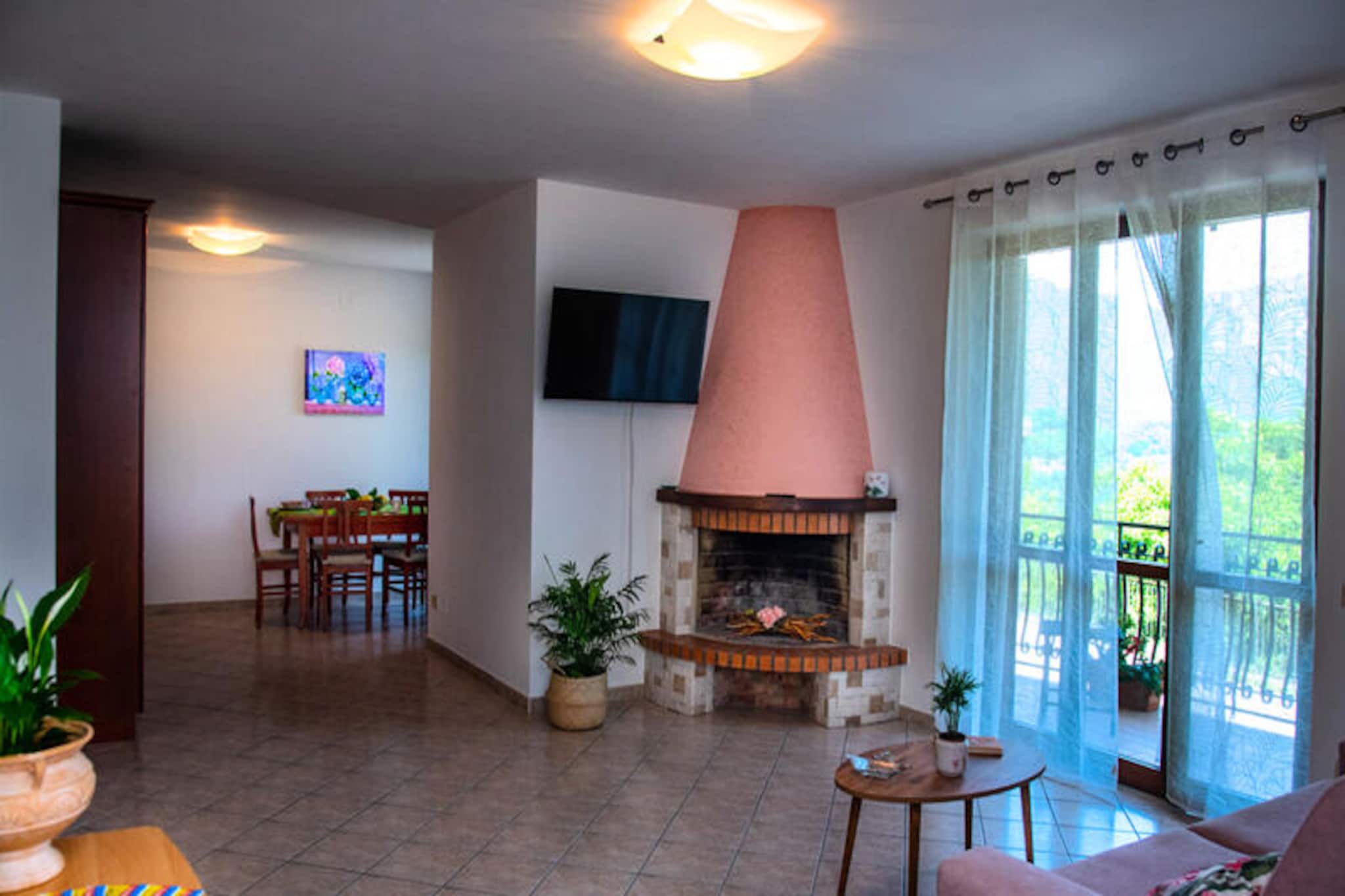 Perched on the serene hills of Tramonti, Casa Tramonti d'aMare offers a tranquil retreat amidst the lush greenery of the Amalfi Coast. This charming apartment is located in the peaceful hamlet of Cesarano, away from the bustling crowds yet just a 15-minute drive from the golden beaches of Maiori. Imagine sipping your morning coffee on the balcony, overlooking rolling hills bathed in sunlight, before setting off to explore the region's breathtaking hiking trails or picturesque coastal towns. The soothing ambiance of this hillside haven is perfect for unwinding and reconnecting with nature. \n\nThe apartment is thoughtfully designed for comfort and convenience, featuring two spacious double bedrooms with ample natural light, and a cozy living room with a sofa bed, television, and decorative fireplace. The fully equipped kitchen opens into the living area, making it ideal for preparing meals and enjoying quality time together. With two bathrooms—one with a bathtub and the other with a shower—Casa Tramonti d'aMare is perfectly suited for families or groups of up to six guests. Free private parking next to the property ensures hassle-free travel, and a nearby bus stop connects you to neighboring towns for easy exploration. \n\nBeyond the property, the Amalfi Coast beckons with its iconic beauty. From the historic ruins of Pompeii and Herculaneum to the vibrant streets of Naples and the majestic Mount Vesuvius, the region offers endless opportunities for adventure and discovery. Whether you're hiking scenic trails, savoring local delicacies at nearby restaurants, or simply soaking in the tranquility of the hills, Casa Tramonti d'aMare is your gateway to an unforgettable Italian escape. Let the charm of Tramonti and the allure of the Amalfi Coast create memories that will last a lifetime.