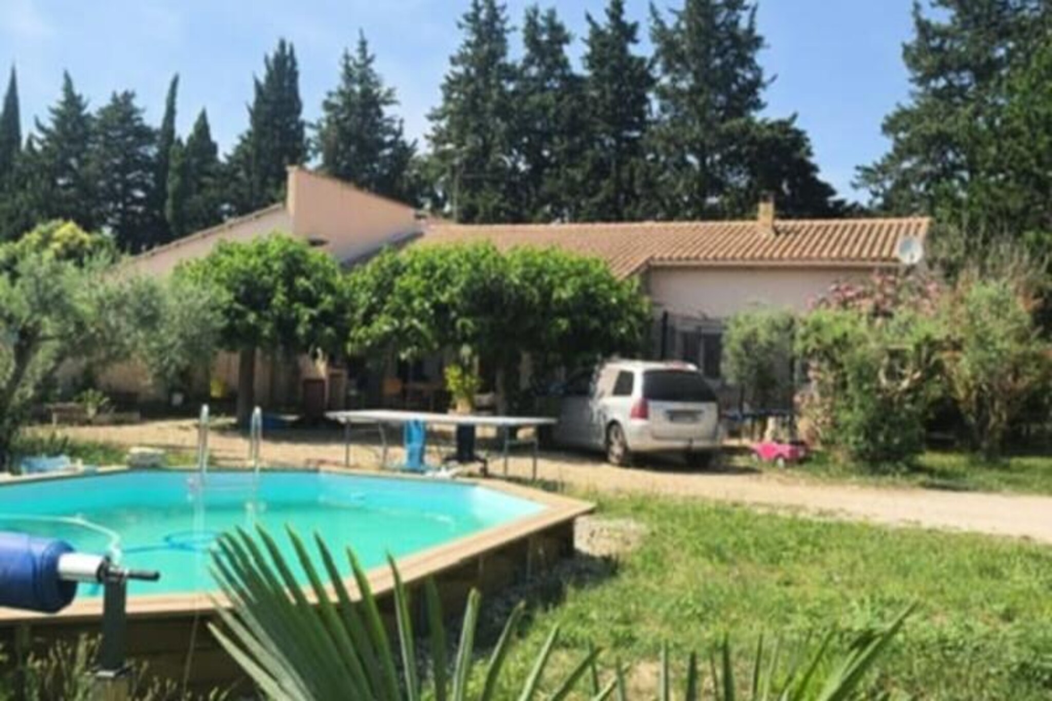 In the heart of Provence, where lavender fields and golden sunlight create a timeless charm, this delightful country house offers a serene escape for families and friends. Just a short three-minute drive from the picturesque town of L'Isle-sur-la-Sorgue, known for its canals, antique shops, and Provençal markets, this property invites you to immerse yourself in the region’s unique atmosphere and beauty. Surrounded by antique villages and rolling hills, it’s the perfect base for exploring the treasures of Provence. 
 
 The house boasts a 6.5 x 4.5 meter semi-inground swimming pool, ideal for cooling off under the warm Provençal sun. For entertainment, guests can enjoy a ping-pong table, pétanque court, swing, and trampoline, ensuring fun for all ages. The spacious terrace, complete with a barbecue, plancha grill, and pizza oven, is perfect for savoring al fresco meals and embracing the art of Provençal living. 
 
 Inside, the home is both welcoming and functional. A bright living-dining area leads to a fully renovated semi-open kitchen, equipped with modern appliances and an annex for groceries. The property features three comfortable double bedrooms, a bathroom with both a shower and bathtub, and a separate toilet. Cleverly placed air conditioning ensures the entire house remains cool during the hottest summer days. 
 
 Beyond the property, Provence awaits. Explore the nearby hilltop villages of the Luberon, the Alpilles, and Fontaine-de-Vaucluse, or enjoy activities such as canoeing on the Sorgue River, wine tasting, hiking, and cycling. With its idyllic setting and proximity to L'Isle-sur-la-Sorgue, this house offers a perfect blend of relaxation and adventure, making it an unforgettable Provençal retreat.