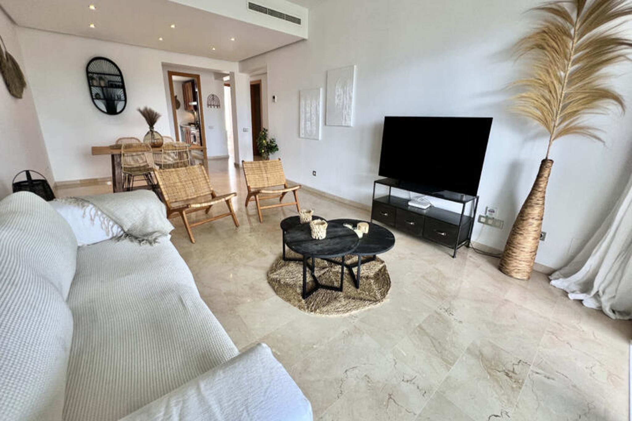 Imagine waking up to the serene beauty of the Costa del Sol, where the rolling greens of a world-class golf course meet the majestic Sierra de Mijas mountains. This spacious and elegantly designed 2-bedroom, 2-bathroom apartment is your perfect retreat for a family vacation or a getaway with friends. With breathtaking views and a tranquil atmosphere, it offers the ideal blend of relaxation and adventure. Whether you're an avid golfer or simply seeking a peaceful escape, this property promises a memorable stay.
Step inside to discover a bright and inviting living-dining area that opens directly onto a private terrace. Here, you can savor your morning coffee or enjoy al fresco dining while soaking in panoramic views of the mountains, La Cala, and the lush golf course. The fully equipped kitchen ensures you have everything you need to prepare your favorite meals, while the master bedroom, complete with a dressing room, en-suite bathroom, and terrace access, provides a luxurious haven. The second bedroom, paired with a modern bathroom featuring a walk-in shower, ensures comfort for all guests.
The secure complex boasts two pristine swimming pools, one for adults and one for children, surrounded by beautifully manicured gardens. Just a 10-minute drive away lies the charming village of La Cala, offering golden beaches, delightful restaurants, boutique shops, and vibrant markets. Whether you’re exploring the coastline, indulging in local cuisine, or simply unwinding by the pool, this apartment places you at the heart of it all.
Book your stay today and experience the perfect combination of luxury, comfort, and the natural splendor of Spain’s Costa del Sol.
