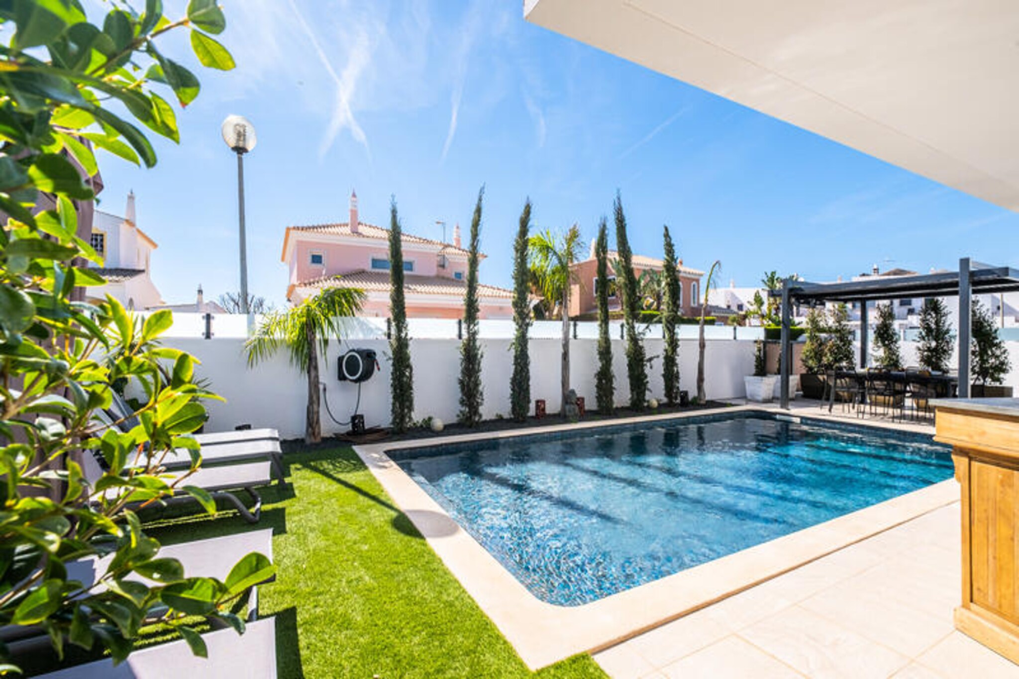 Imagine waking up in a serene oasis where the golden Algarve sun streams through your windows, inviting you to step outside and embrace the day. This luxurious home in Albufeira is designed to offer both relaxation and entertainment, making it the perfect retreat for families or groups of friends. Situated just 1.5 km from the beach, it combines the tranquility of a private haven with the convenience of easy access to the vibrant coastal life of the Algarve. Whether you’re seeking sun-soaked days by the sea or quiet evenings under the stars, this property is your gateway to unforgettable moments. \n\nSpanning two floors, the house features three spacious bedrooms and an expansive open-plan living area that includes a cozy lounge, elegant dining space, and a fully equipped kitchen. Fitness enthusiasts will appreciate the gym equipment, including a treadmill and exercise bike, while those looking to unwind can enjoy the private pool surrounded by lush greenery. The outdoor barbecue area is perfect for al fresco dining, and the ping-pong table and table football promise hours of fun for all ages. Every detail has been thoughtfully curated to ensure your stay is as comfortable as it is memorable. \n\nBeyond the property, the stunning beaches of Albufeira await, offering crystal-clear waters and golden sands ideal for sunbathing, swimming, or water sports. The nearby town is brimming with charming restaurants, lively bars, and local markets, providing a taste of authentic Portuguese culture. Explore the Algarve’s breathtaking coastline, venture into the rolling countryside, or simply relax by the pool with a refreshing drink in hand. \n\nThis home is more than just a place to stay—it’s a destination in itself. Book your escape today and discover why Albufeira is one of Portugal’s most beloved holiday spots.