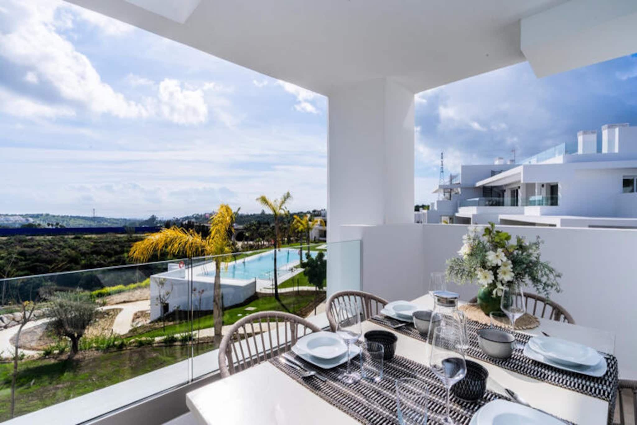 Amid the sun-kissed hills of Casares, this modern apartment invites you to experience the ultimate Mediterranean escape. With exclusive access to Europe’s first Crystal Lagoon, this property is a haven for relaxation and adventure. Picture yourself waking up to the gentle rustle of palm trees, stepping onto your private terrace, and savoring the tranquil views of tropical gardens and shimmering waters. Whether you’re seeking serene mornings or lively afternoons, this destination caters to every mood. \n\nThe apartment is thoughtfully designed for comfort and convenience, featuring two spacious bedrooms that accommodate up to four guests. The fully equipped kitchen makes meal preparation a breeze, while the airy living space offers high-speed Wi-Fi and a Smart TV with international channels. Outside, your private garden and terrace provide the perfect setting for al fresco dining or unwinding under the Andalusian sky. Shared amenities include a swimming pool, children’s play area, and outdoor parking, ensuring a seamless stay for families and couples alike. \n\nLocated just 100 meters from the Crystal Lagoon, you’ll enjoy unlimited access to its sandy beach, water sports, and sun loungers. Nearby, the Alcazaba Lagoon Restaurant serves Mediterranean delights, while Estepona’s vibrant town center and beaches are a short drive away. Golf enthusiasts will appreciate the proximity to Estepona Golf and other prestigious courses, including Valderrama Golf Resort. For nature lovers, the Sierra Crestellina Natural Park offers hiking trails and breathtaking vistas. \n\nWhether you’re drawn to the allure of the lagoon, the charm of Estepona, or the thrill of outdoor adventures, this property promises an unforgettable Costa del Sol experience. Let the beauty of Casares captivate your senses and create lasting memories.