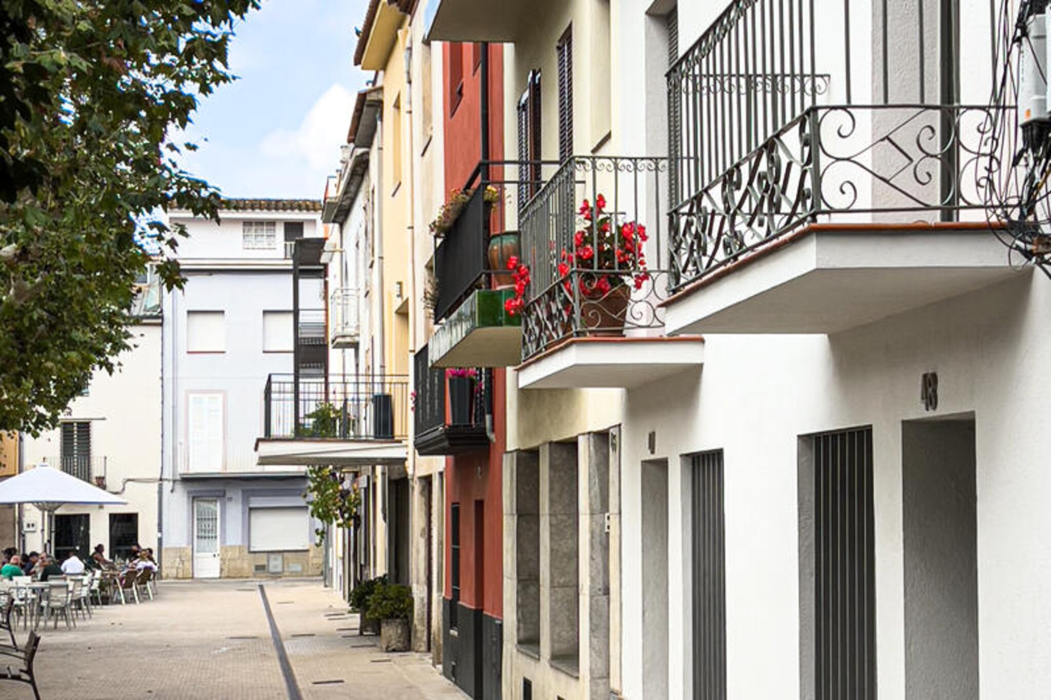 In the heart of the enchanting town of Banyoles, Ca les Cosines 47 invites you to experience the perfect blend of modern comfort and historic charm. Overlooking the lively Plaça de les Rodes, this beautifully renovated holiday home offers a serene retreat just steps away from the vibrant life of the town. Whether you're sipping coffee on the balcony or exploring the cobblestone streets, every moment here feels like a step into Catalonia's rich culture and natural beauty.
This meticulously restored house, completed in 2022, combines contemporary elegance with thoughtful details. On the ground floor, a spacious and fully equipped kitchen with a dining area awaits, perfect for preparing meals with fresh local ingredients from the nearby Wednesday market. The cozy living room, featuring a large smart TV and views of the square, is an ideal spot to unwind after a day of adventure. Upstairs, two tranquil bedrooms with single beds offer restful nights, with the front bedroom boasting French doors that open to a charming balcony. High-speed internet and a dedicated workspace make it easy to stay connected, whether for work or leisure. A private parking space and secure gated access add to the convenience of your stay.
Step outside, and you'll find yourself immersed in the vibrant atmosphere of Banyoles. The town's famous lake, just a short walk away, is a haven for nature lovers and sports enthusiasts, offering opportunities for rowing, kayaking, and cycling. Wander through the historic old town, where centuries-old architecture meets bustling cafes and restaurants serving traditional Catalan cuisine. Don't miss the weekly market on Plaça de les Rodes, a delightful showcase of local flavors and crafts.
Whether you're seeking a peaceful getaway or an active holiday, Ca les Cosines 47 is your gateway to the best of Banyoles. Book your stay today and create unforgettable memories in this picturesque corner of Catalonia.
