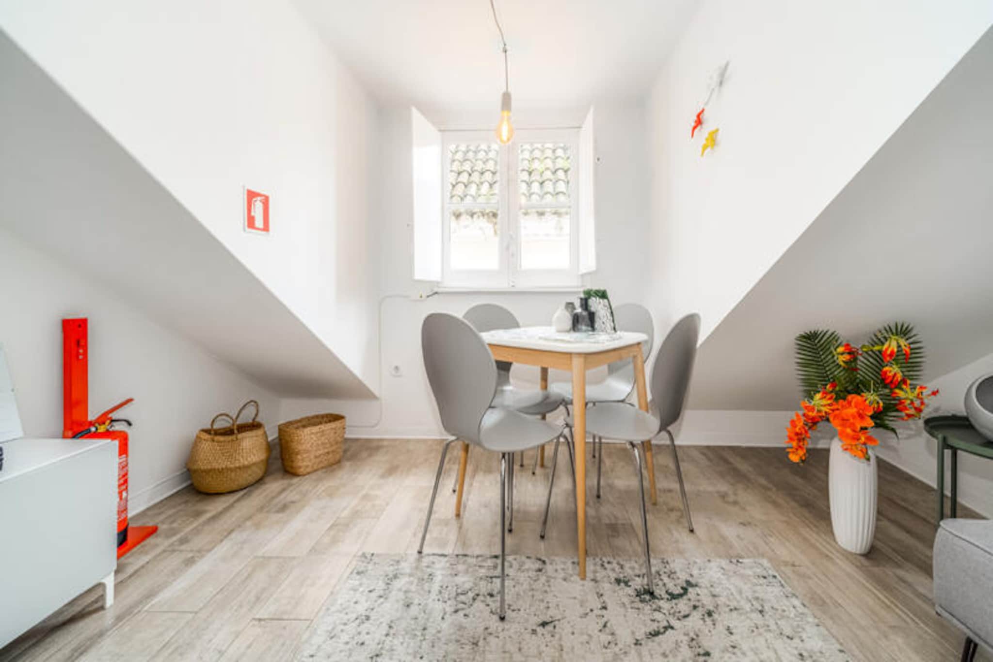 In the heart of Lisbon’s historic Alfama district, this charming apartment invites you to immerse yourself in the city’s vibrant culture and timeless beauty. Surrounded by narrow cobblestone streets, traditional Fado music, and stunning views of the Tagus River, this is the perfect retreat for those seeking an authentic Lisbon experience. Wake up to the gentle hum of the city, explore its iconic trams, and enjoy the unique blend of old-world charm and modern comforts.
This cozy 30 m² apartment is thoughtfully designed to accommodate two guests. The bedroom offers a tranquil space to rest, while the living area is both welcoming and modern, featuring air conditioning, Wi-Fi, and a satellite TV with multiple language channels. The fully equipped kitchen, complete with a ceramic hob, refrigerator, microwave, and toaster, allows you to prepare meals with ease, whether it’s a quick breakfast before sightseeing or a romantic dinner for two. Additional amenities such as an iron and hairdryer ensure a comfortable stay.
Step outside, and you’ll find yourself just moments away from Lisbon’s most iconic attractions. The famous Tram 28 route, bustling Baixa-Chiado metro station, and the picturesque Tagus River are all within walking distance. Savor local delicacies at nearby restaurants like Restaurante Floresta das Escadinhas or enjoy a coffee at the historic A Brasileira café. For those looking to explore further, the Jardim Botânico, the beaches of Carcavelos, and the stunning Sintra-Cascais Natural Park are easily accessible.
Whether you’re here to discover Lisbon’s rich history, indulge in its culinary delights, or simply relax and soak in the atmosphere, this apartment offers the perfect base for an unforgettable stay in Portugal’s captivating capital.