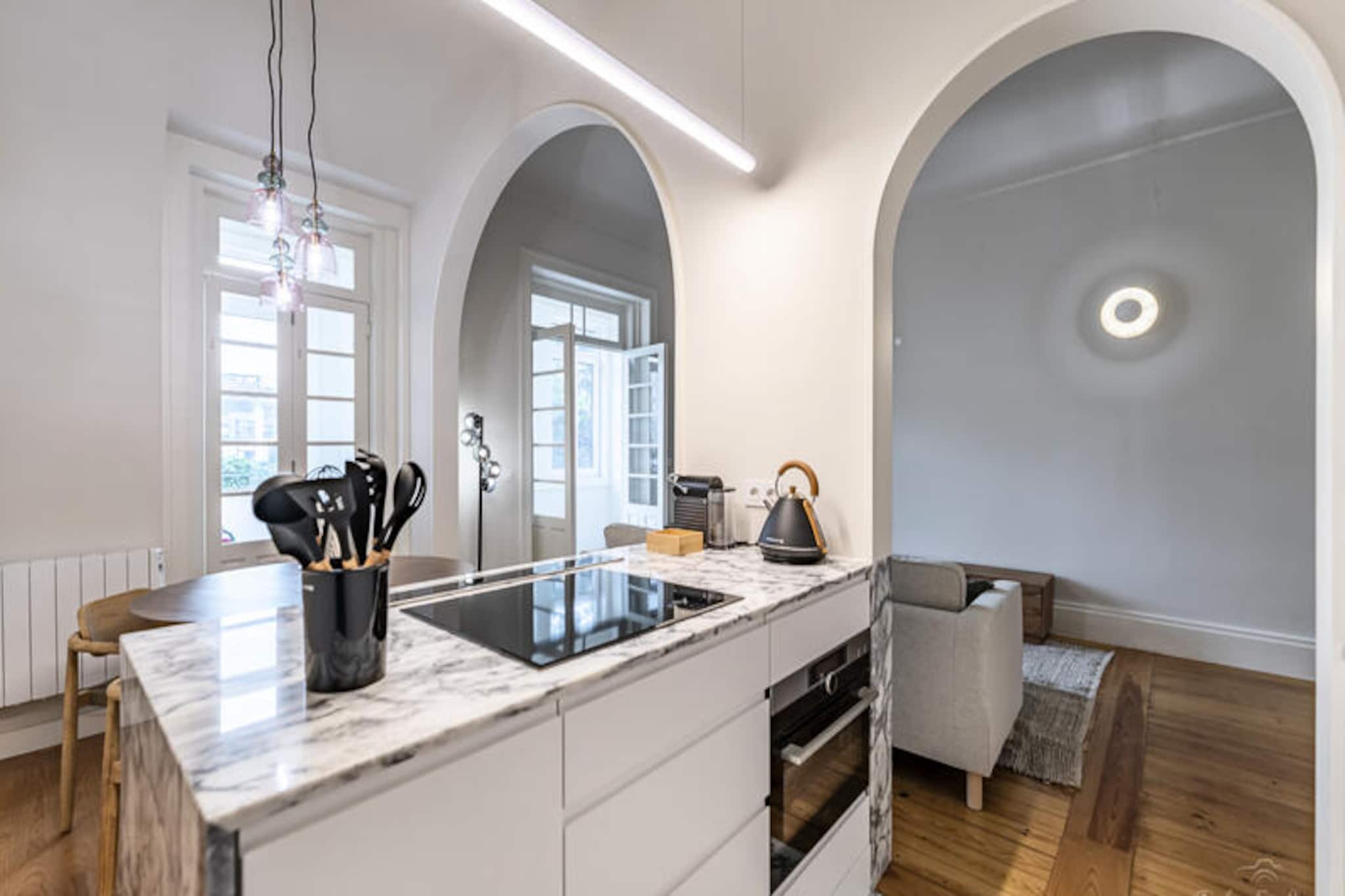 In the heart of Porto, where the charm of historic streets meets the vibrant energy of modern city life, this spacious three-bedroom apartment offers a serene retreat for up to five guests. With its prime location, you can enjoy the best of both worlds—peaceful residential surroundings and easy access to the city's highlights. Imagine starting your day with a coffee on the 20 m² terrace, soaking in the gentle morning light before heading out to explore the wonders of Porto.
Inside, the 150 m² apartment is thoughtfully designed for comfort and convenience. The bright and airy living spaces are complemented by modern amenities such as Wi-Fi, satellite TV, central heating, and a fully equipped kitchen with everything from a dishwasher to a coffee maker. The bedrooms are cozy and inviting, ensuring restful nights after a day of adventure. Practical touches like a washing machine, iron, and hairdryer make it an ideal choice for longer stays or families seeking a home away from home.
Step outside, and you'll find yourself just 15 meters from the golden sands of Madalena Beach, perfect for sunbathing or a refreshing swim. The nearby bus station and Marquês metro station provide seamless connections to Porto's iconic landmarks, while the Pingo Doce supermarket is just a short walk away for all your essentials. For golf enthusiasts, Miramar Golf Course is a mere 15 km away, and the bustling Matosinhos Beach is within easy reach for seafood lovers.
Whether you're here to wander the cobbled streets of Ribeira, savor local delicacies, or simply relax by the sea, this apartment is your gateway to an unforgettable Porto experience. Let the blend of city and coastal charm create memories you'll cherish forever.