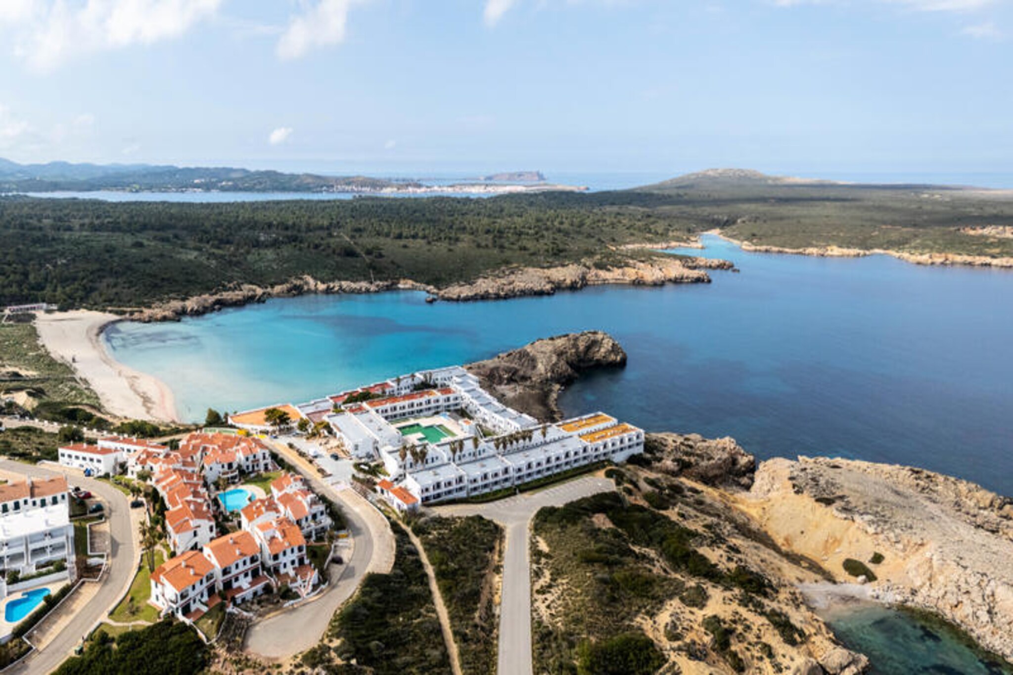 Imagine waking up to the sound of the Mediterranean waves and stepping out onto your private terrace to enjoy uninterrupted sea views. This stunning apartment in the Aldeamar community is a true gem, offering a perfect blend of relaxation and recreation. Surrounded by lush gardens and featuring a spectacular pool with a cascading waterfall, this property invites you to unwind and savor the beauty of coastal Spain. Just a few meters away, a direct path leads you to a sandy beach where a charming beachside restaurant awaits, making every day feel like a holiday. \n\nThe apartment is thoughtfully designed to cater to your every need. The spacious terrace, equipped with an awning for sunny days, is ideal for enjoying meals, reading, or simply soaking in the tranquil atmosphere. Inside, the bright and airy living spaces, fully equipped kitchen, and comfortable bedrooms ensure a seamless stay. The coastal breeze and ceiling fans provide natural cooling, eliminating the need for air conditioning and enhancing the refreshing ambiance. \n\nFor those seeking activities, the nearby park offers a mini golf championship area, perfect for enthusiasts or beginners looking to try their hand at the sport. Whether you’re traveling with family or friends, this location provides a harmonious mix of leisure and adventure. \n\nWith its unbeatable location, breathtaking views, and exceptional amenities, this apartment promises an unforgettable escape. Let the Aldeamar community be your sanctuary by the sea, where every moment is filled with joy and serenity.