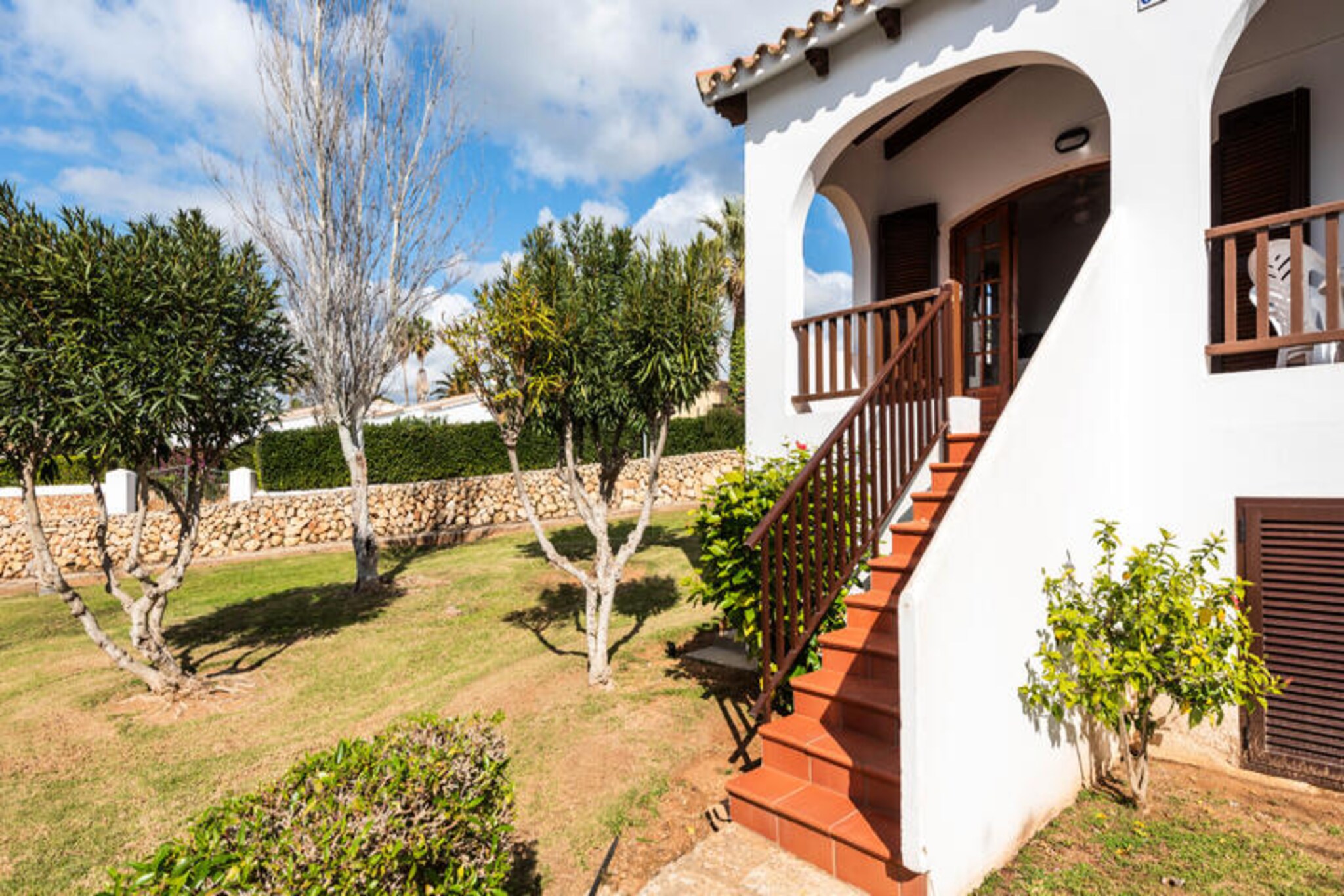 Imagine waking up to the gentle sound of Mediterranean waves and stepping out onto your private terrace to soak in the lush surroundings of a beautifully landscaped garden. This delightful apartment in the heart of Son Bou offers a serene escape for families and friends seeking both relaxation and adventure. With its vibrant new decor inspired by the sea, sand, and sky, every corner of this home invites you to unwind and embrace the island's charm. The two terraces, fully furnished and equipped, provide the perfect setting for morning coffees or evening gatherings under the stars. Inside, you'll find two modern bathrooms and ample space to comfortably accommodate up to six guests, making it ideal for creating unforgettable memories together.
Just a short walk away lies the stunning Son Bou beach, renowned for its golden sands and crystal-clear waters. Stretching for miles, this beach is perfect for leisurely strolls along the shore, with the option to walk all the way to Santo Tomás. Families will love the children's play areas, while adventurers can rent boats to explore the coastline. As the sun sets, enjoy a delicious meal at one of the beachfront restaurants, some of which feature live jazz music for a truly magical dining experience.
Whether you're lounging by the community's large swimming pool, exploring the vibrant local scene, or simply soaking in the tranquil atmosphere, this apartment offers the perfect base for your Menorcan getaway. Let the beauty of Son Bou and the comforts of this charming home transport you to a world of relaxation and joy.