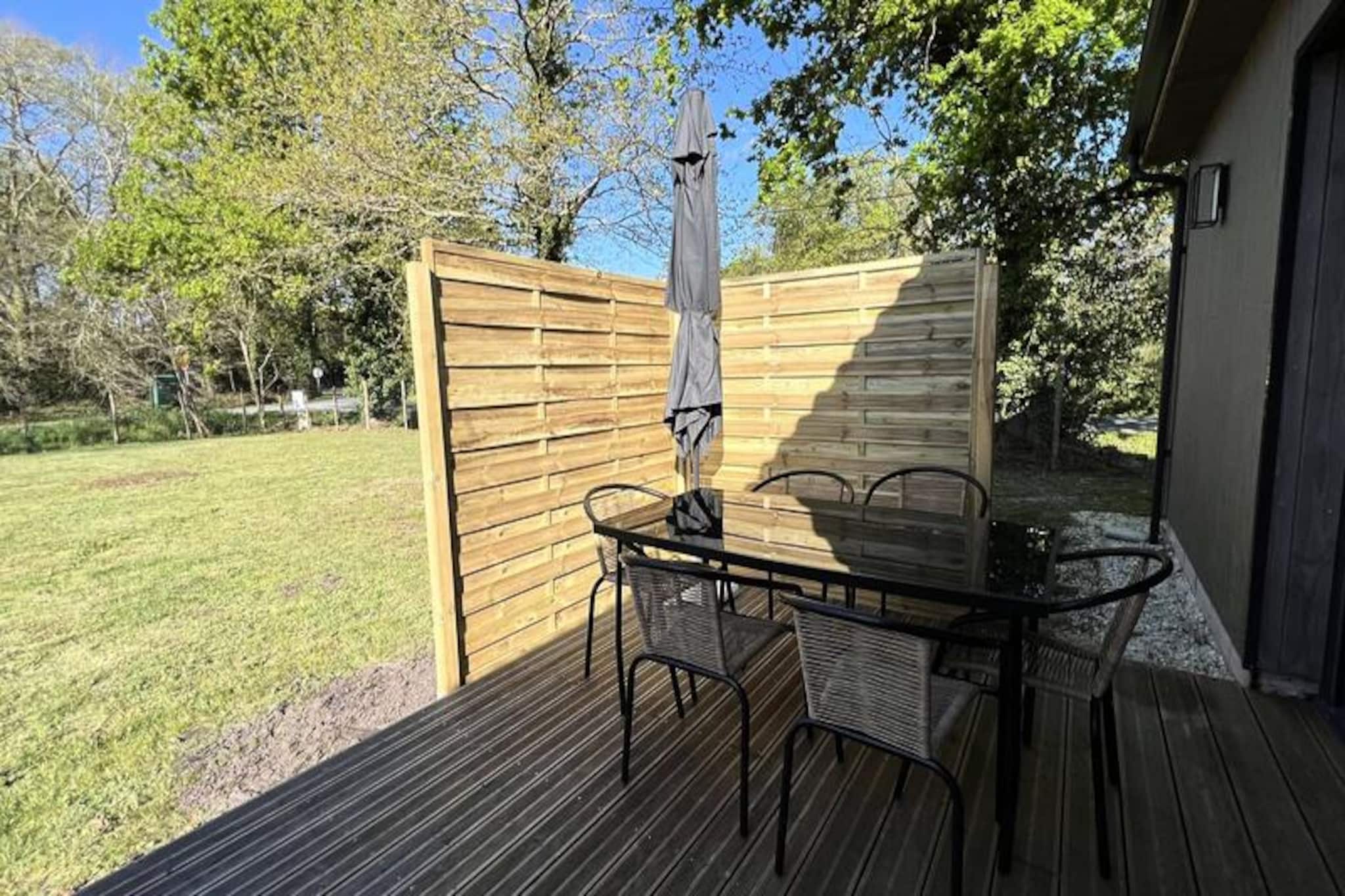 Amidst the serene landscapes of Grayan-l'Hôpital, this charming holiday home offers a perfect retreat for those seeking tranquility and nature. Located between Soulac-Mer and Montalivet, it’s less than 10 minutes from the region’s stunning beaches, where you can enjoy swimming, surfing, or simply relaxing by the Atlantic waters. Surrounded by lush pine forests, the property invites you to explore scenic hiking and cycling trails, making it a haven for outdoor enthusiasts and families alike. The gentle rustle of the trees and the fresh coastal air set the tone for an unforgettable stay. \n\nInside, the house comfortably accommodates up to six guests across three cozy bedrooms, each featuring double beds and ample storage space. The fully equipped kitchen, complete with oven, microwave, refrigerator, and dishwasher, ensures you can prepare delicious meals with ease. The spacious and sunlit living room provides a welcoming space to unwind, while the modern shower room and separate toilet add convenience to your stay. Every detail has been thoughtfully designed to combine comfort and practicality. \n\nStep outside to discover a sunny terrace and enclosed garden, perfect for al fresco dining or relaxing with a book. The garden furniture and barbecue make it easy to enjoy long summer evenings under the stars. With Wi-Fi access available, you can stay connected while immersing yourself in the peaceful surroundings. \n\nWhether you’re drawn to the wild beauty of the nearby beaches or the enchanting trails through the pine forest, this property offers the ideal base to experience the best of the Gironde region. Create lasting memories with loved ones in this idyllic coastal retreat.