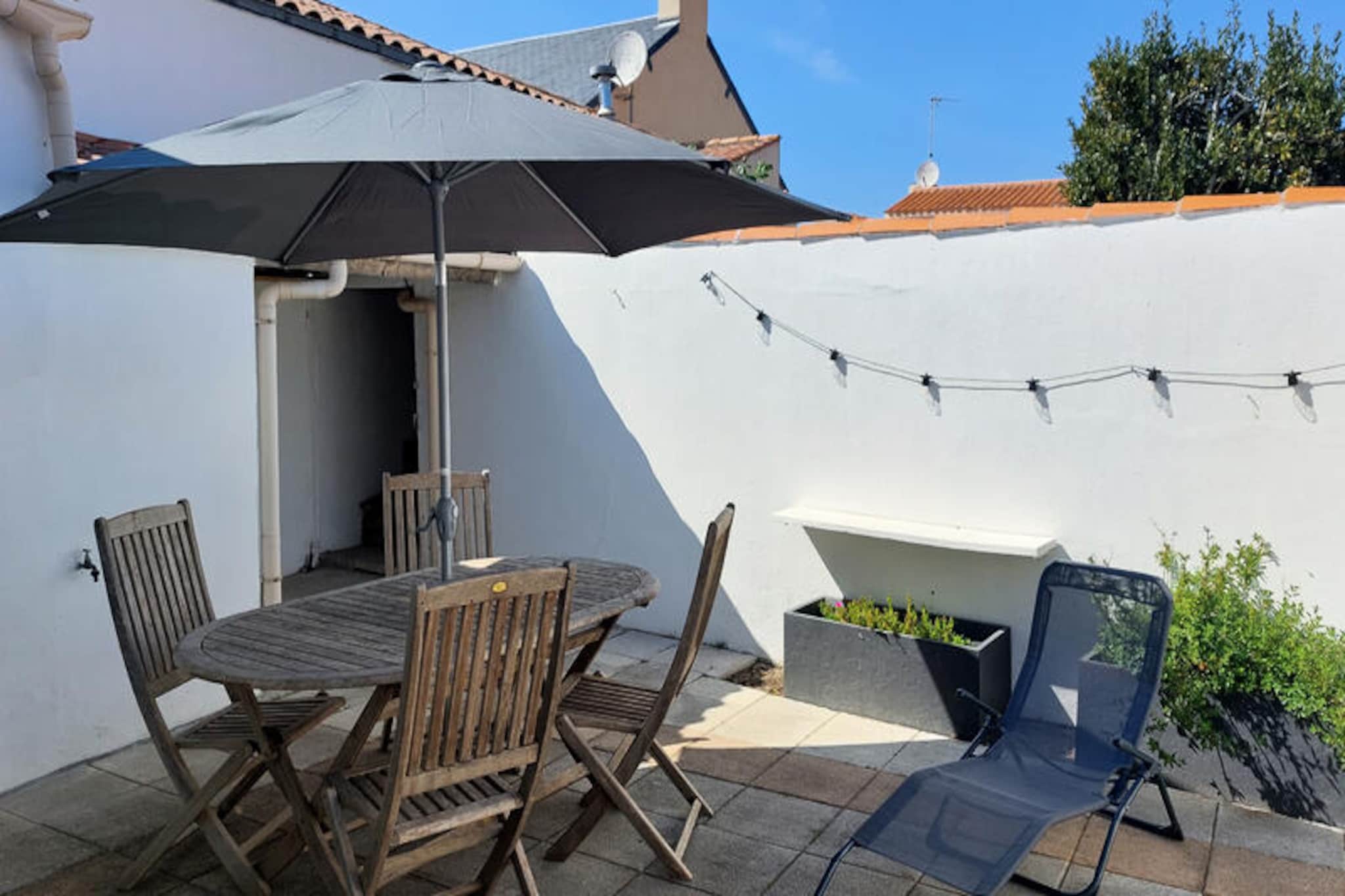In the heart of La Chaume, a historic district of Les Sables-d'Olonne, this charming fisherman's house invites you to experience the perfect blend of tranquility and coastal vibrancy. Imagine waking up in a peaceful setting, surrounded by the authentic charm of a neighborhood steeped in maritime history, while being just steps away from bustling markets, quaint shops, and the picturesque Port Olonne. Whether you're seeking a romantic getaway or a family retreat, this elegant accommodation offers a truly immersive experience in one of France's most beloved seaside towns. \n\nThe house comfortably sleeps five guests across three thoughtfully designed bedrooms, including a master suite with a private bathroom. A second bathroom ensures convenience for all, while the open-plan kitchen and cozy living room provide the ideal space for relaxation and shared moments. The kitchen is fully equipped with modern appliances, including a dishwasher, oven, and coffee makers, making it easy to prepare delicious meals after a day of exploring. Step outside to a delightful flower-filled terrace, perfect for unwinding with a glass of wine or storing bikes and surfboards securely in the shelter provided. \n\nLa Chaume offers a true village atmosphere, with everything you need just a short stroll away. From the lively Place Maraud market to the charming Quai de la Chaume lined with shops and restaurants, you'll find plenty to explore. The Pointe du Prieuré Saint Nicolas and the wild coast are within walking distance, offering stunning natural beauty and opportunities for seaside adventures. For a unique experience, take the ferry boat to the town center and the expansive beach of Les Sables-d'Olonne, just 700 meters away. \n\nThis enchanting property is more than just a place to stay; it's a gateway to unforgettable memories. Whether you're drawn to the serene terrace, the vibrant local culture, or the proximity to the coast, this fisherman's house is the perfect choice for your next holiday.