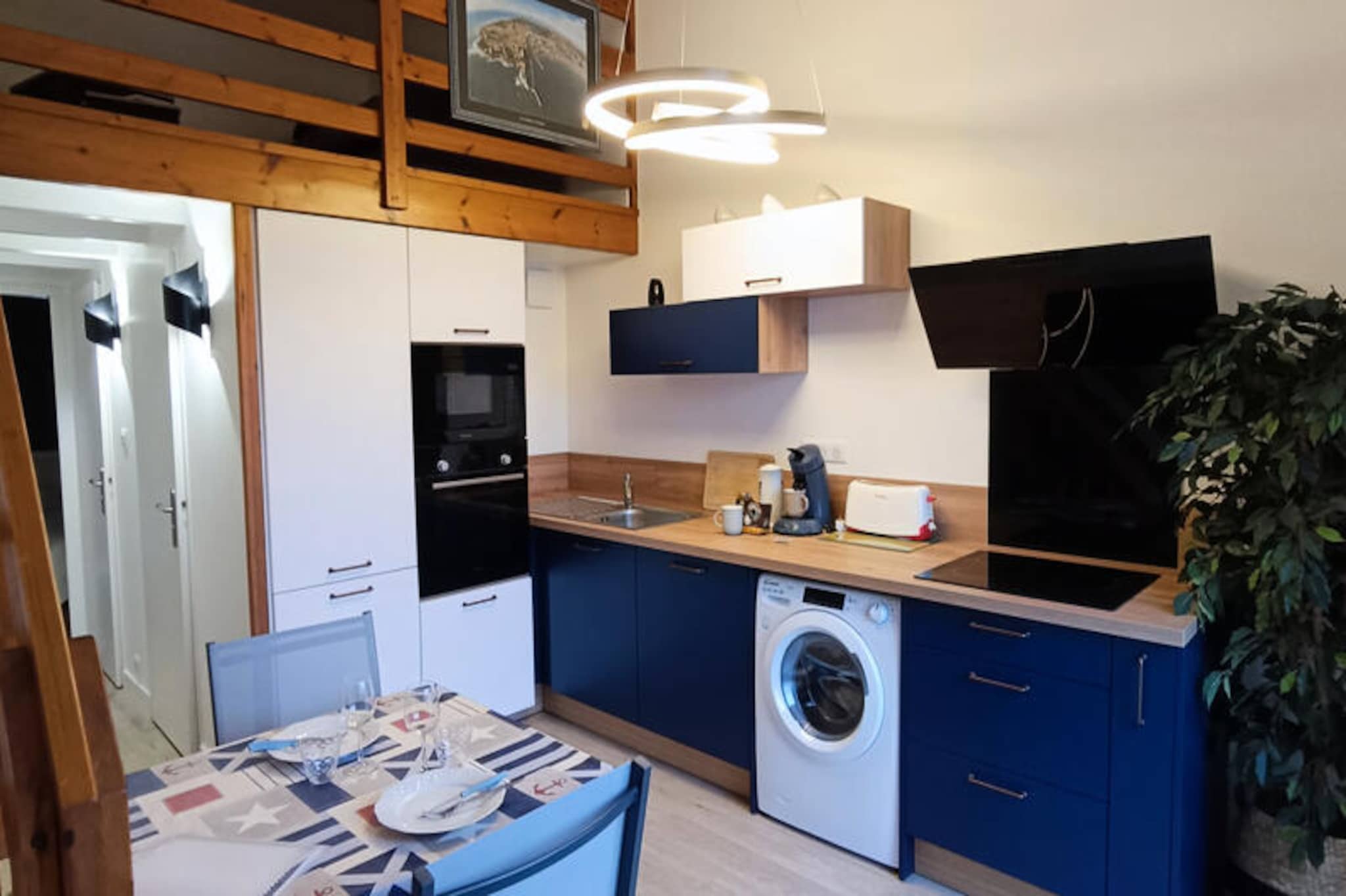 In the historic La Chaume district of Les Sables-d'Olonne, where the city’s roots intertwine with the charm of the Atlantic coast, this beautifully renovated apartment invites you to experience the essence of seaside living. From its second-floor perch, this cozy retreat offers a blend of modern comfort and authentic French coastal ambiance, perfect for couples or small groups seeking a memorable getaway. Imagine strolling through quaint streets, breathing in the salty sea air, and discovering the vibrant marina just steps away. Whether you're here for the Vendée Globe or a tranquil escape, this location is ideal for immersing yourself in the rhythm of the ocean and the town’s rich culture.
Inside, the apartment is thoughtfully designed to ensure a relaxing stay. The entrance hall welcomes you with ample storage space, leading to a bright dining area and a fully equipped kitchen featuring an oven, microwave, refrigerator-freezer, dishwasher, and washing machine. The bedroom boasts a queen-size bed with built-in wardrobes, while the mezzanine lounge area offers a flat-screen TV and a comfortable sofa bed with a real mattress. A separate toilet and a bathroom with a bathtub complete the layout, ensuring convenience and privacy. With ADSL Wi-Fi and a private parking space, every detail has been considered for your comfort.
Step outside and find yourself surrounded by everything you need. Shops, restaurants, bike rentals, and public transport are all within walking distance. The picturesque Port Olona is just 200 meters away, while Paracou Beach, with its free parking, is only 1.4 kilometers from your doorstep. For a unique experience, hop on the nearby ferry to explore the main beach, town center, or other attractions. Whether you’re seeking adventure with jet skiing and boating or simply wish to unwind at a local café, La Chaume offers it all.
This apartment is more than a place to stay; it’s a gateway to the heart of Les Sables-d'Olonne. Let the ocean breeze and the charm of La Chaume create unforgettable memories during your stay.
