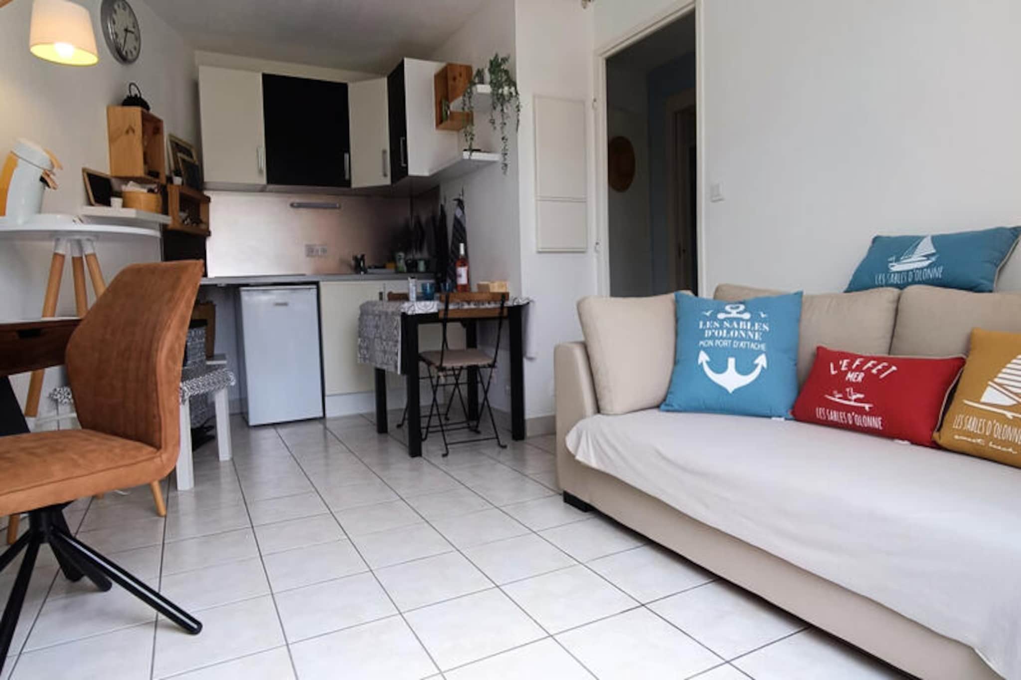 In the heart of the historic Chaume district of Les Sables-d'Olonne, this delightful cottage offers a serene retreat just steps from the iconic Armandèche lighthouse and the picturesque coastal paths. Surrounded by the charm of this maritime neighborhood, you'll feel the essence of the region's rich history while enjoying modern comforts. The private garden invites you to unwind under the sun, while the shared swimming pool promises refreshing moments during the warmer months. Whether you're here for a romantic getaway or a peaceful escape, this property is the perfect base to explore the beauty of the Vendée coastline. \n\nStep inside and discover a thoughtfully designed space that blends comfort with functionality. The living room is a cozy haven, complete with a sofa, television, dining area, and even a desk for those who need to stay connected. The fully equipped kitchen is ready for your culinary adventures, featuring everything from a coffee maker to condiments. The master suite boasts a comfortable 140x190 cm bed and a private bathroom with a modern shower, while a separate dressing room and toilet add convenience. A washing machine ensures longer stays are hassle-free. Outside, the private garden with seating is ideal for al fresco dining or simply soaking up the coastal ambiance. \n\nLocated just 900 meters from Quai de la Chaume, you'll find a vibrant selection of shops, restaurants, and a lively market. The charming passeur boat, only 1km away, provides a quick and scenic route to the main beach and the bustling town center. Seafood lovers will delight in the fresh platters available just 750 meters from your door, and a supermarket is conveniently located 2km away for all your essentials. With cycle paths, coastal trails, and the charm of Les Sables-d'Olonne at your fingertips, this cottage is your gateway to unforgettable memories by the sea. \n\nWhether you're exploring the nearby attractions or simply relaxing in the garden, this property offers the perfect blend of tranquility and adventure. Book your stay today and experience the magic of the Vendée coast.