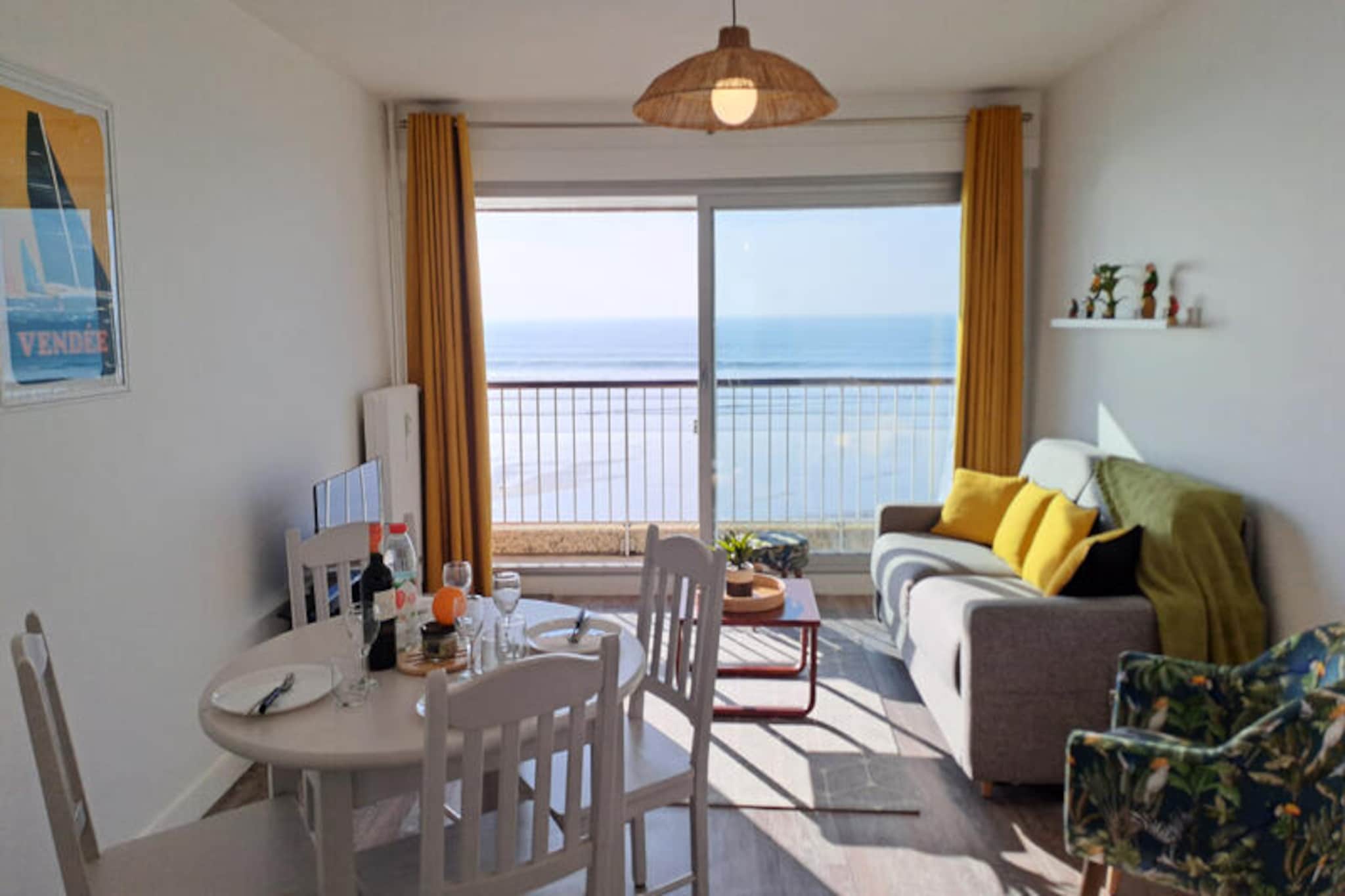 With the shimmering Atlantic stretching before you, this stunning 4-star apartment offers an unparalleled seaside retreat in Les Sables d'Olonne, home to one of the world's most beautiful bays. Imagine waking up to the gentle sound of waves and stepping onto your private balcony to soak in a breathtaking 180° view of the ocean. Bright and inviting, this modern haven is designed to immerse you in coastal charm while providing all the comforts of home. Whether you're looking for a romantic getaway or a relaxing escape, this apartment is your gateway to the magic of the French seaside. \n\nInside, you'll find a thoughtfully renovated 42m² space that blends style and practicality. The living room, complete with a sofa bed, dining table, and TV, opens directly onto the balcony, ensuring you never miss a moment of the stunning views. The open-plan kitchen is fully equipped with high-quality appliances, including a Delonghi coffee maker, oven, and dishwasher, making meal preparation a breeze. The bedroom offers flexible sleeping arrangements with a king-size bed or two singles, while the bathroom features a relaxing bathtub. Fiber optic Wi-Fi and ample storage ensure a seamless stay. \n\nLocated on the embankment, the apartment is perfectly positioned to explore the vibrant town of Les Sables d'Olonne. Stroll along the pedestrianized promenade, enjoy local restaurants, or simply bask in the sun on the golden sands. For surfers and cyclists, the shared storage area is an added convenience, while private parking ensures stress-free arrivals and departures. \n\nWhether you're savoring fresh seafood, exploring the nearby attractions, or simply unwinding with a glass of wine as the sun sets over the bay, this apartment promises an unforgettable coastal experience. Book your stay and let the beauty of Les Sables d'Olonne captivate you.