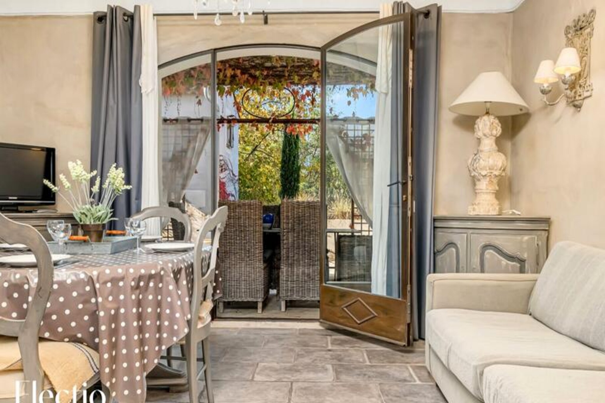 In the heart of Provence, where the golden light dances on lavender fields and olive groves, lies the enchanting Loggia 2 Glycine. This charming ground-floor apartment, nestled within the Residence Les Petitons in Oppède, offers a serene escape for 2 to 4 guests. Surrounded by the picturesque beauty of the Luberon Regional Park, this 53 m² haven invites you to experience the authentic Provençal lifestyle, complete with private terraces and a seasonally heated swimming pool. Imagine mornings filled with birdsong and evenings under a starlit sky, all while enjoying the timeless charm of this Mediterranean retreat.
Step inside and discover a thoughtfully designed space that blends modern comfort with traditional Provençal elegance. The main bedroom, bathed in natural light, features a plush 160x200 cm bed and refined furnishings, while a second cozy bedroom with wooden bunk beds exudes warmth and intimacy. The bright living area is perfect for unwinding, with a comfortable sofa, TV, and a fully equipped open kitchen boasting an induction hob, dishwasher, espresso machine, and more. The modern bathroom, with its walk-in shower and stone sink, adds a touch of luxury to your stay. Two private terraces, one offering breathtaking views of the Petit Luberon and the other a tranquil breakfast spot, complete this idyllic setting.
Beyond the apartment, the Residence Les Petitons enchants with its Mediterranean garden, adorned with lavender, century-old olive trees, and a charming fountain. Guests can relax by the heated pool, enjoy shaded pergolas, or explore the nearby medieval village of Oppède-le-Vieux. The residence also offers practical amenities, including private parking, a laundry room, and concierge services to help you make the most of your stay.
Whether you’re seeking relaxation, adventure, or a taste of Provençal culture, Loggia 2 Glycine is your gateway to the Luberon’s treasures. From hiking trails and vineyards to local markets and historic landmarks, every moment here promises to be unforgettable.