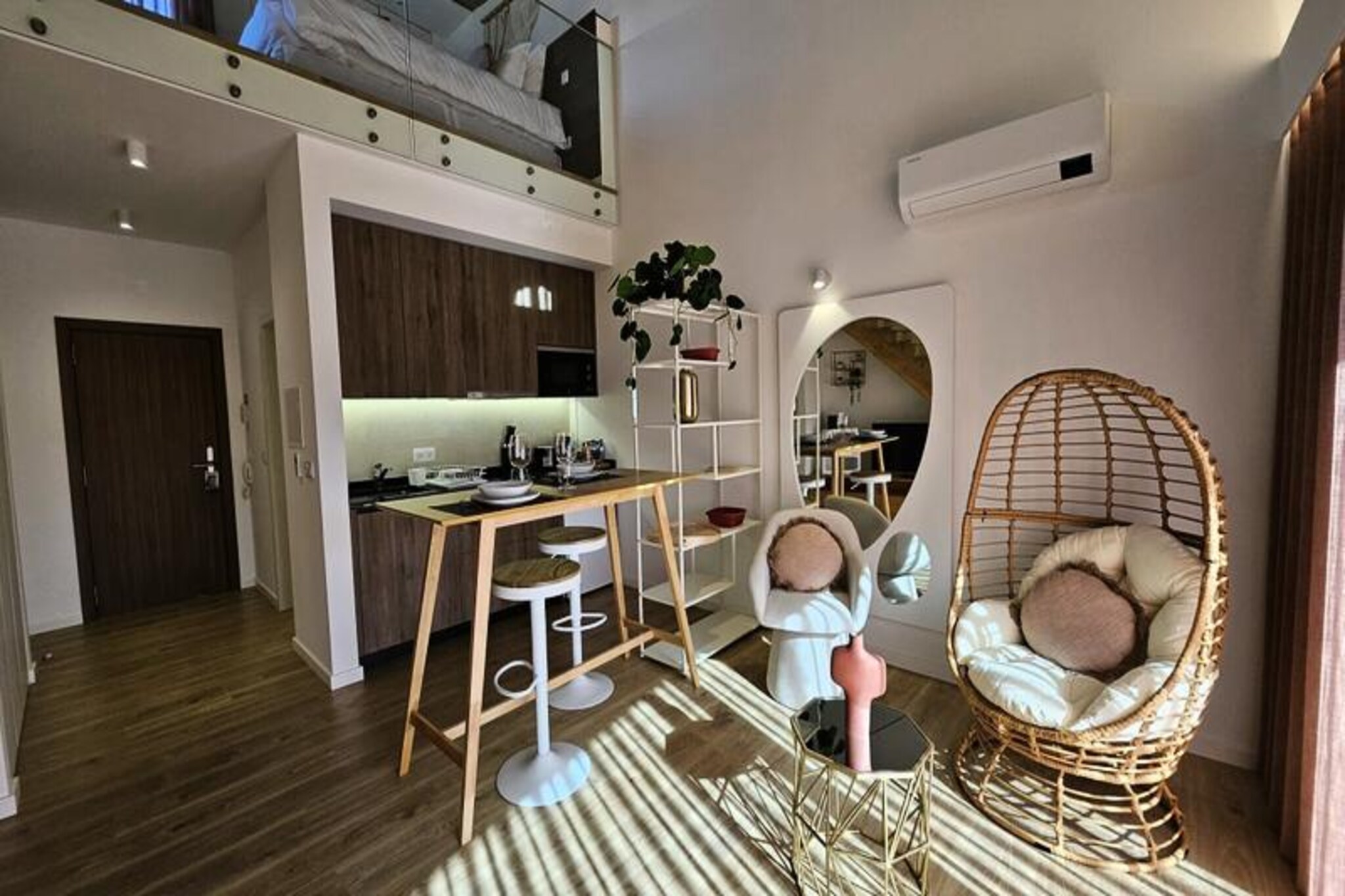 In the heart of Portugal’s Silver Coast region, this modern and stylish apartment offers the perfect blend of comfort, convenience, and leisure. Whether you’re here for a business trip, a remote working retreat, or a relaxing holiday, this brand-new property is designed to meet all your needs. With its central location, you’re just a 10-minute drive from pristine beaches and the charming city of Leiria, while the vibrant cities of Porto and Lisbon are easily accessible for day trips. For nature enthusiasts, the surrounding area boasts scenic cycling paths and lush landscapes waiting to be explored.
Step inside Loft Néo Nº8 and discover a thoughtfully designed space that combines contemporary elegance with practical amenities. The apartment features a cozy terrace, an entrance hall with ample storage, and a fully equipped kitchen complete with modern appliances such as a microwave, hob, refrigerator-freezer, and coffee maker. The living area invites you to unwind with a comfortable seating arrangement, a dining space, and entertainment options like cable TV, Netflix, and YouTube. Upstairs, the bedroom offers a luxurious king-size bed and a dedicated office area, perfect for work or relaxation. Additional features include electric blinds, reversible air conditioning, and high-speed fiber optic Wi-Fi for ultimate convenience.
Guests will also enjoy access to premium on-site facilities, including a swimming pool, a fitness room, and a secure garage equipped with a Tesla charger. Laundry services are available for an additional fee, and stays exceeding one week include weekly cleaning and fresh linens. The property is managed remotely with a smart lock system, ensuring a seamless and hassle-free experience from check-in to check-out.
Whether you’re exploring the cultural treasures of Leiria, cycling along the Silver Coast, or simply soaking up the sun by the pool, this apartment offers a serene and sophisticated base for your Portuguese getaway. Book your stay now and experience the perfect balance of modern luxury and regional charm.