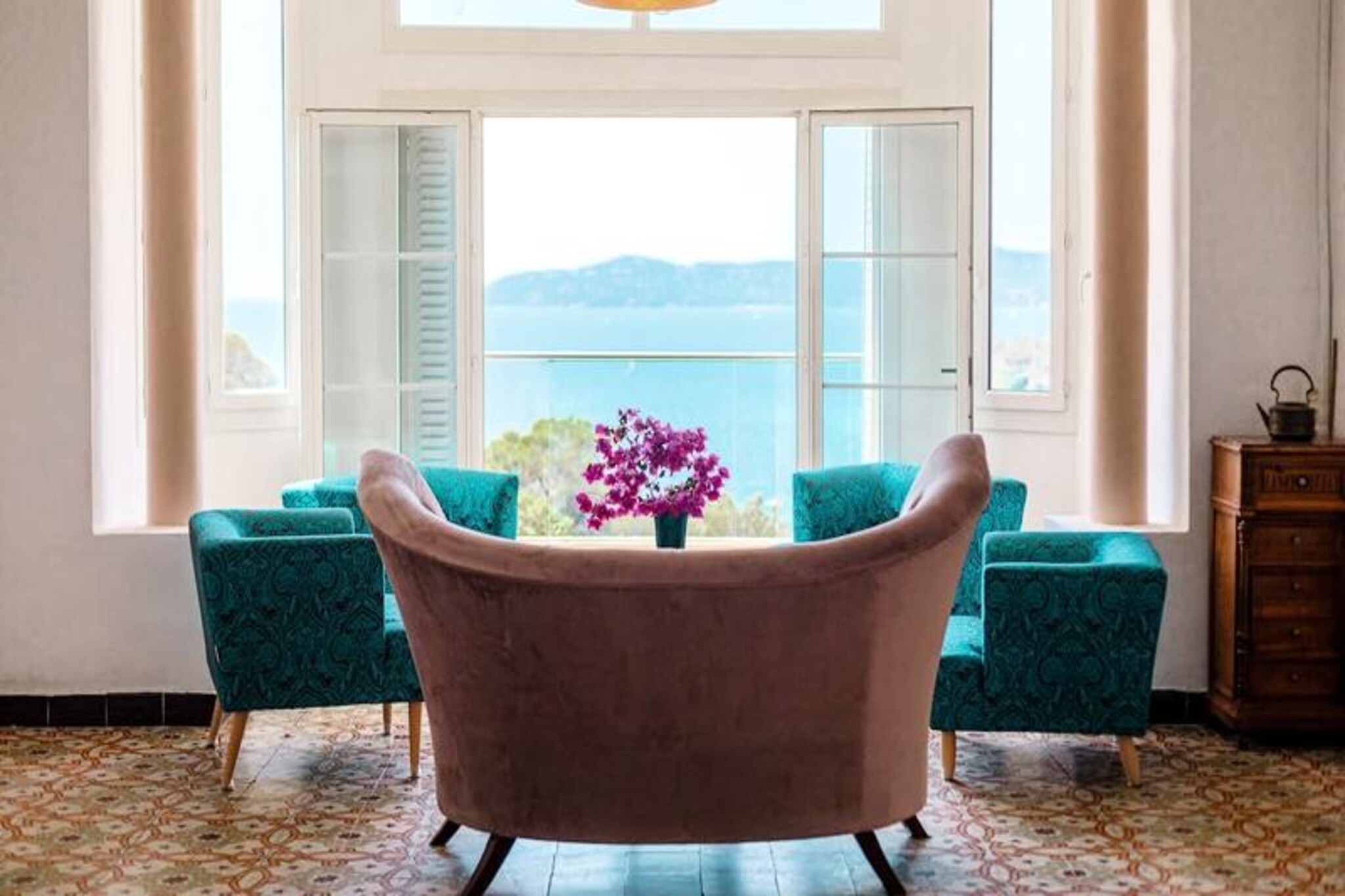 Step into the charm of Villa Amiot, where history and modern comfort blend seamlessly in the picturesque village of Aiguebelle. This beautifully renovated century-old villa invites you to experience a unique stay surrounded by timeless elegance, from its original stained-glass windows to its period tiles. Perched above the Mediterranean, the villa offers breathtaking sea views, a serene atmosphere, and a perfect escape for families or groups seeking both relaxation and adventure. 
 
 The villa spans two levels, thoughtfully designed to provide ample space and comfort for up to 12 guests. On the first level, you’ll find a bright and spacious living room with panoramic sea views, a cozy library with a foosball table, a fully equipped kitchen, and a charming bedroom. Upstairs, five air-conditioned bedrooms, each with its own shower room, ensure restful nights after days of exploration. Outdoors, the private swimming pool (3m x 4m) overlooks the sea, while the shaded pétanque court offers a quintessentially French pastime. The villa also features a generous parking area for your convenience. 
 
 Just a short stroll away lies Aiguebelle Beach, a hidden gem of golden sands and crystal-clear waters. Start your day with breakfast by the shore as the sun rises, or dive into the vibrant underwater world teeming with sea bream, octopus, and colorful marine life. The beach’s intimate yet lively ambiance makes it ideal for families, couples, and snorkeling enthusiasts alike. 
 
 Whether you’re savoring the villa’s historic charm, lounging by the pool, or exploring the natural beauty of Le Lavandou, Villa Amiot promises a holiday filled with unforgettable moments.