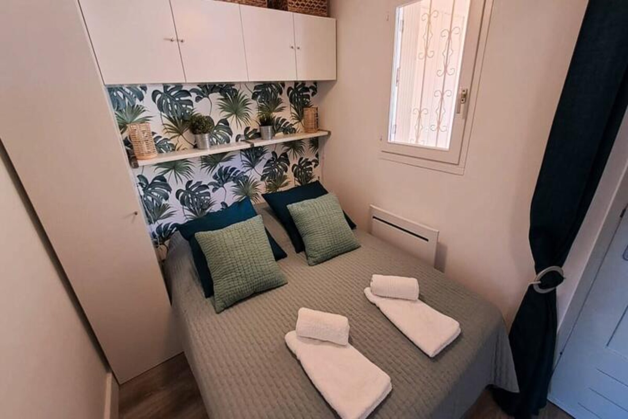 Awaken your senses in the serene Saint-Clair district, where Mediterranean charm meets modern comfort. This newly renovated apartment on the first floor of the Plage d'Or residence offers a tranquil retreat just steps from the dazzling Saint-Clair beach, often called 'The Pearl' for its fine white sand and breathtaking views of the Golden Islands. Imagine mornings bathed in golden sunlight and evenings spent savoring the gentle sea breeze on your private terrace. Whether you're seeking relaxation or adventure, this idyllic setting promises unforgettable moments. \n\nInside, the apartment is thoughtfully designed to ensure your stay is as comfortable as possible. The air-conditioned living space includes a smart TV for entertainment, a fully equipped kitchen for culinary creations, and a separate sleeping area for restful nights. The modern shower area adds a touch of luxury, while bed linens, towels, and essentials are provided for your convenience. A private parking space directly below the residence makes exploring the surrounding area effortless. \n\nSaint-Clair beach, just a short stroll away, is a hidden gem with its tropical-like landscape framed by pine forests and mountains. Regularly ranked among the most beautiful beaches in France, it offers a peaceful escape with shops, restaurants, and grocery stores within walking distance. Nearby, Le Lavandou invites you to explore its vibrant coastal charm, while the Golden Islands—Port Cros and Le Levant—beckon for day trips filled with natural beauty and adventure. \n\nWhether you're drawn to the crystal-clear waters, the lush surroundings, or the convenience of local amenities, this apartment is your gateway to the best of the French Riviera. Make your stay in Saint-Clair a memory to treasure forever.