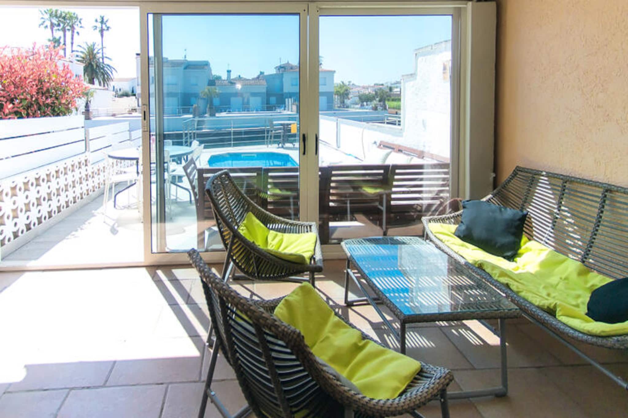 In the heart of the charming town of Empuriabrava, this delightful two-story house invites you to experience the perfect blend of comfort and coastal charm. With its unique location overlooking the famous canals, this property offers a serene retreat for up to six guests, ideal for families or groups seeking relaxation and adventure in equal measure. Imagine waking up to the gentle sound of water and starting your day with a refreshing swim in your private pool, surrounded by the beauty of the Costa Brava. \n\nSpanning 90 m², the house is thoughtfully designed to provide a welcoming and functional space. The ground floor features a spacious living room with panoramic windows that frame stunning views of the river, creating a bright and airy ambiance. The fully equipped kitchen ensures you can prepare delicious meals with ease, while the three cozy bedrooms—two with double beds and one with twin beds—promise restful nights. Two modern bathrooms add to the convenience, making this home a haven of comfort. \n\nStep upstairs to discover a terrace that offers breathtaking vistas of Empuriabrava’s iconic waterways. Whether you’re sipping your morning coffee or unwinding with a glass of wine as the sun sets, this spot is perfect for soaking in the tranquil surroundings. Private parking is also available, ensuring a hassle-free stay. \n\nEmpuriabrava is renowned for its vibrant marina, sandy beaches, and outdoor activities such as boating and cycling. Explore the nearby nature reserves, indulge in local cuisine at waterfront restaurants, or simply relax by the pool and let the Mediterranean breeze rejuvenate your spirit. This house is more than just a place to stay—it’s an invitation to create unforgettable memories in one of Spain’s most picturesque destinations.
