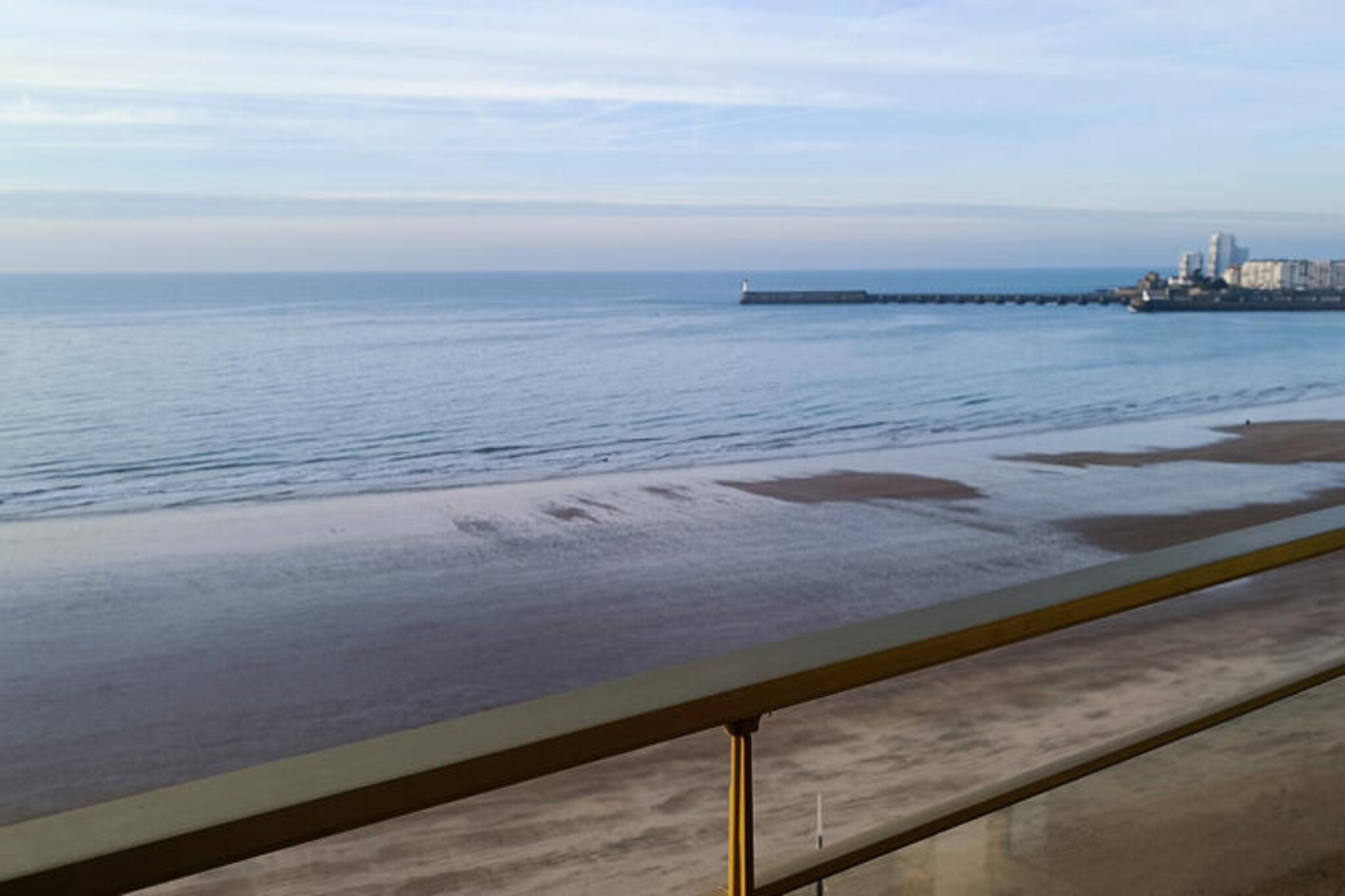 High above the shimmering waters of Les Sables-d’Olonne, this elegant studio apartment offers a front-row seat to one of the world’s most stunning bays. Located on the 8th floor of a well-maintained building, this retreat combines modern comfort with breathtaking views, making it the perfect choice for a romantic getaway or a peaceful escape. Imagine waking up to the sun rising over the ocean, stepping onto your private balcony, and feeling the gentle sea breeze as you sip your morning coffee. The embankment at the foot of the building invites you to stroll along the coastline and soak in the vibrant atmosphere of this charming seaside town.
Inside, the apartment is thoughtfully designed to maximize space and comfort. The spacious 30m² layout includes an entrance hall for convenient storage, a bright living area with a newly installed Murphy bed that ensures restful nights, and a fully equipped kitchen with everything you need to prepare delicious meals. From ceramic hobs to a Senseo coffee maker, every detail has been considered to enhance your stay. For added flexibility, a convertible ottoman with a mattress topper provides a third sleeping option, making this studio ideal for couples or small families.
Step outside and discover the delights of Les Sables-d’Olonne. The town center, bustling with shops and cafes, is just a short 10-minute walk away, while the famous Arago market and a Carrefour supermarket are even closer. Indulge in fresh pastries from the bakery next door or treat yourself to a refreshing ice cream from the parlor just steps away. In summer, the embankment comes alive with beachfront restaurants offering local specialties and stunning sunset views.
Whether you’re here to celebrate a special occasion or simply unwind by the sea, this apartment offers a unique blend of comfort, convenience, and coastal charm. Let the beauty of Les Sables-d’Olonne inspire unforgettable memories during your stay.