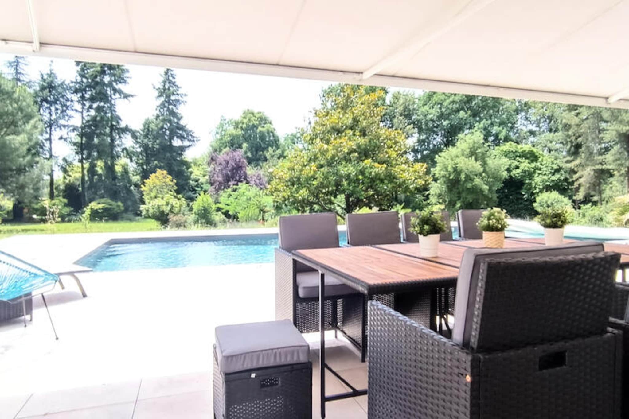 Amid the serene landscapes of the Bas-Bocage Vendée, this luxurious villa offers a tranquil escape surrounded by nature. Located near the enchanting Chaos de Piquet in the Yon Valley, this residence is perfectly positioned between the Vendée beaches, the Marais Poitevin, and the world-renowned Puy du Fou. Whether you’re seeking relaxation or adventure, this property promises an unforgettable stay in the heart of western France. \n\nStep into a contemporary haven nestled within a sprawling 2-hectare wooded park. The villa boasts high-end amenities, including a spacious living room with a fully equipped open-plan kitchen and large bay windows that frame breathtaking views of the outdoors. Cozy up by the wood-burning stove during cooler months or unwind with Netflix on the flat-screen TV. The house offers two distinct sleeping areas, ensuring privacy and comfort for all guests. From the master suite with its king-size bed and private bathroom to the charming children’s room with a bunk bed, every detail has been thoughtfully designed. \n\nThe expansive terrace, accessible from multiple rooms, invites you to enjoy alfresco dining with garden furniture, a barbecue, and a stunning 12m x 5m swimming pool, which can be heated upon request. Additional conveniences include a garage, laundry facilities, and baby essentials, making it ideal for families. \n\nWith its proximity to Les Sables d'Olonne, La Rochelle, and Nantes, as well as tailored options like in-home massages and themed stays, this villa is more than a holiday home—it’s an experience. Discover the beauty of Vendée and create lasting memories in this exceptional retreat.