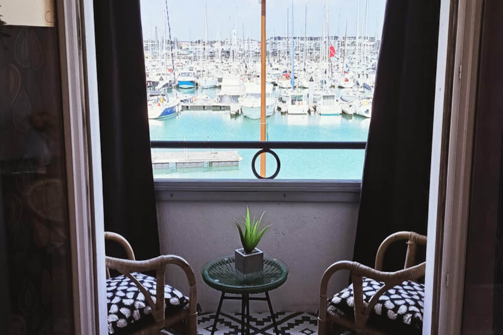 Overlooking the charming Port Olona marina, this cozy first-floor apartment offers a serene retreat in the heart of Les Sables-d'Olonne’s historic La Chaume district. Imagine waking up to the gentle sounds of the harbor and enjoying your morning coffee on the loggia, where the bay window frames picturesque views of the boats gently bobbing in the water. Whether you're seeking a peaceful getaway or an adventure-filled holiday, this apartment provides the perfect base to explore the vibrant coastal town. \n\nInside, the apartment is thoughtfully designed for comfort and convenience. The entrance hall features a single bed tucked into an alcove, ideal for a restful night’s sleep. The spacious living room doubles as a dining area and kitchen, equipped with everything you need to prepare delicious meals, including a microwave, Tassimo coffee maker, and toaster. The sofa easily converts into a double bed, making the space versatile for couples or small families. The bathroom boasts a slipper bathtub and practical storage, ensuring a relaxing and functional stay. \n\nStep outside and discover the best of Les Sables-d'Olonne at your fingertips. A short 4-minute walk takes you to the ferry, offering quick access to the main beach and a refreshing sea breeze. Nearby, you’ll find a variety of shops, restaurants, and markets, including the bustling Quai de la Chaume and the vibrant market by the Arundel Tower. Supermarkets, pharmacies, and local eateries are all within walking distance, making it easy to immerse yourself in the town’s lively atmosphere. \n\nWhether you prefer exploring by foot, bike, or ferry, this apartment’s prime location ensures you can experience everything Les Sables-d'Olonne has to offer. From its stunning marina views to its proximity to local attractions, this property promises an unforgettable coastal escape.