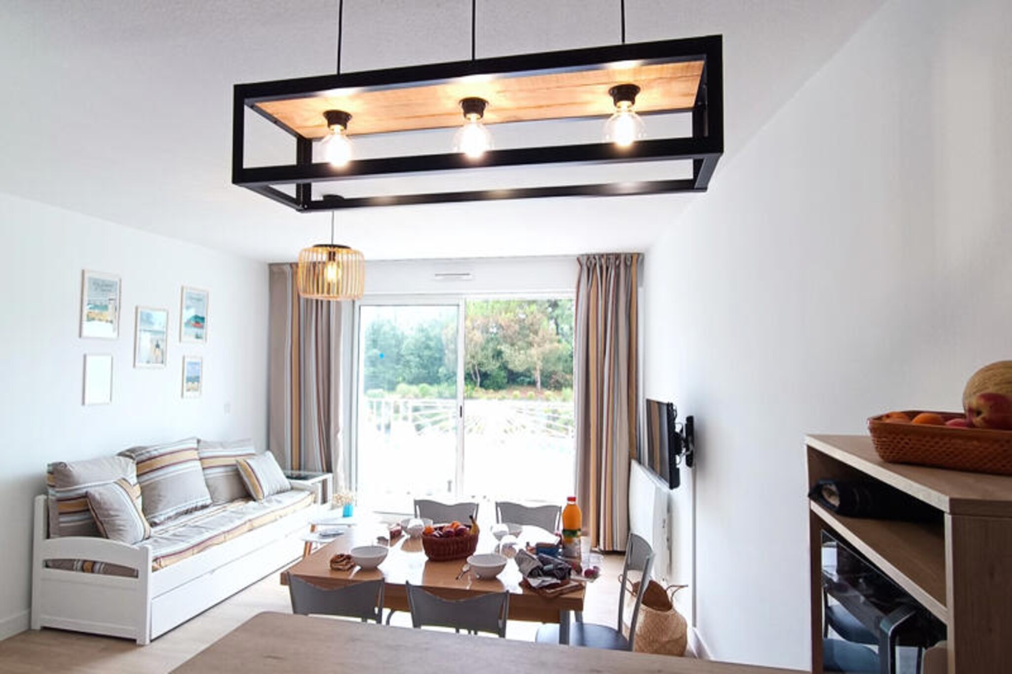 Step into a world of relaxation and coastal charm at this delightful apartment in Les Sables-d'Olonne. With its south/southwest-facing balcony overlooking a serene pine forest and the sparkling swimming pool, this residence offers a tranquil escape just a short walk from the beach. Whether you're seeking a peaceful retreat or an active holiday, the vibrant surroundings cater to every mood and interest. From morning strolls by Lake Tanchet to evenings exploring the lively local restaurants and casino, every moment is an opportunity to create lasting memories. \n\nThis 4-star apartment is thoughtfully designed for comfort and convenience. Located on the second floor with elevator access, it features two cozy bedrooms—one with a queen-size bed and ample storage, and another with two single beds that can be joined. The living room invites you to unwind with its comfortable sofa, while the fully equipped kitchen makes preparing meals a breeze with modern appliances like a refrigerator/freezer, dishwasher, oven, and microwave. A washing machine, television, and cleaning products are provided to ensure a hassle-free stay. Guests also benefit from a secure underground parking space for added peace of mind. \n\nBeyond the residence, the area is brimming with attractions. The heated swimming pool, open from mid-May to late September, is perfect for relaxing afternoons. Tennis courts, a zoo, spa facilities, and lush forests are all within easy reach, making it an ideal destination for families and couples alike. Whether you’re soaking up the sun on the sandy shores or exploring the charming streets of Les Sables-d'Olonne, this location offers the best of coastal living. \n\nChoose this apartment for your next getaway and experience the perfect blend of comfort, convenience, and natural beauty. From its premium amenities to its unbeatable location, it’s the ultimate base for discovering the treasures of the French Atlantic coast.