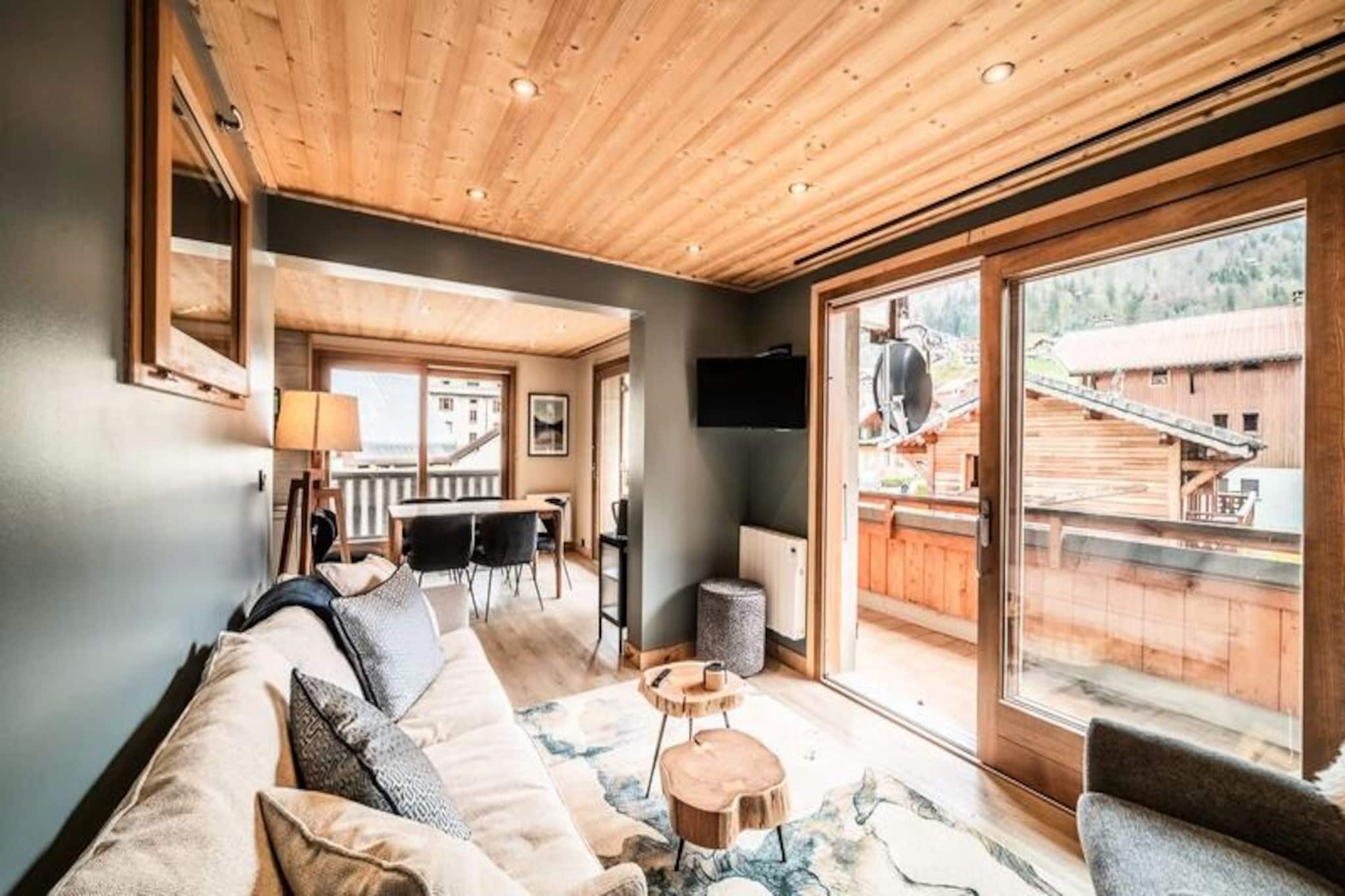 Amidst the vibrant charm of Morzine, Janin 3 invites you to experience the perfect alpine getaway. This cozy 67m² apartment is perched on the first floor of a charming residence, offering a large balcony that frames picturesque views of the village below. Whether you're here to explore the snowy slopes or the lush summer trails, its central location ensures easy access to all the delights Morzine has to offer. Just steps away, the free shuttle stop connects you effortlessly to the region's renowned attractions and activities. 
                        Inside, the apartment is thoughtfully designed for comfort and convenience. The welcoming living room features a fully equipped kitchen, a lounge area, and a dining space that opens onto the balcony, creating a seamless flow for relaxation and socializing. The sleeping arrangements include two double bedrooms and a cozy bunk bed area, ideal for families or small groups. Modern amenities such as Wi-Fi, bed linen, and towels are provided, while the spacious cellar offers secure storage for skis and bicycles. 
                        Morzine's lively village atmosphere is right at your doorstep, with charming shops, restaurants, and local events to explore. In winter, the slopes are just a shuttle ride away, promising world-class skiing and snowboarding. Summer transforms the region into a haven for hikers and cyclists, with breathtaking trails and the exclusive Multipass program granting access to a variety of activities. 
                        Janin 3 is more than just a place to stay—it's your gateway to the beauty and adventure of the French Alps. With its warm ambiance and unbeatable location, this apartment promises unforgettable memories in every season.