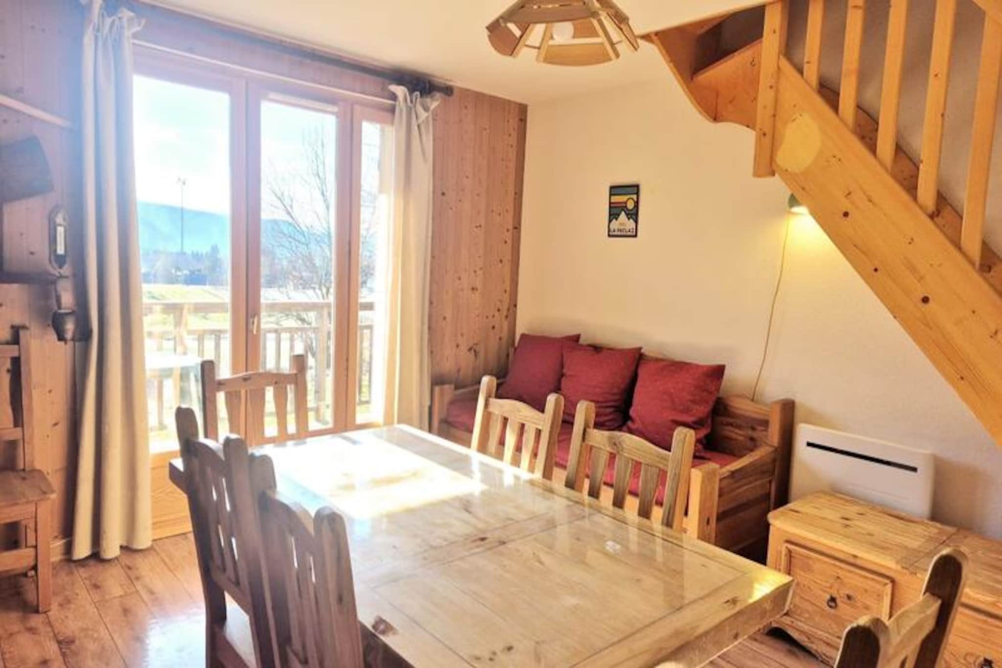 Surrounded by the stunning beauty of the Bauges massif, this charming mountain chalet in La Féclaz invites you to experience the perfect alpine getaway. With its warm ambiance and thoughtful design, this cozy retreat is ideal for families or groups of up to six, offering a harmonious blend of comfort and convenience amidst breathtaking natural landscapes. Whether you're seeking adventure or relaxation, this property is your gateway to unforgettable moments in the heart of the French Alps.\n\nThe chalet spans two levels, featuring a bright and spacious living room equipped with a television for cozy evenings. The fully equipped kitchen includes modern appliances such as a refrigerator, freezer, microwave, mini oven, dishwasher, and even specialty items like a fondue maker and raclette grill for authentic Savoyard dining experiences. Three inviting bedrooms ensure restful nights: two with double beds, one offering picturesque mountain views, and a third with bunk beds perfect for children. Additional amenities include a balcony with panoramic vistas, a shower room, a bathroom with a bathtub, and separate toilets. Sheets and towels are provided, and beds are made upon arrival for your convenience.\n\nLa Féclaz offers direct access to downhill and Nordic ski slopes, making it a paradise for winter sports enthusiasts. In summer, explore the UNESCO-listed Bauges massif via scenic hiking trails that start right from the village. Nearby shops, restaurants, and seasonal activities ensure you have everything you need within easy reach. During school holidays, guests enjoy complimentary access to the swimming pool, sauna, and games room, adding extra delight to your stay.\n\nWhether you're here to ski, hike, or simply unwind in nature, this chalet promises a memorable escape where comfort meets alpine charm. Create lasting memories in this exceptional setting, perfect for reconnecting with loved ones and the great outdoors.