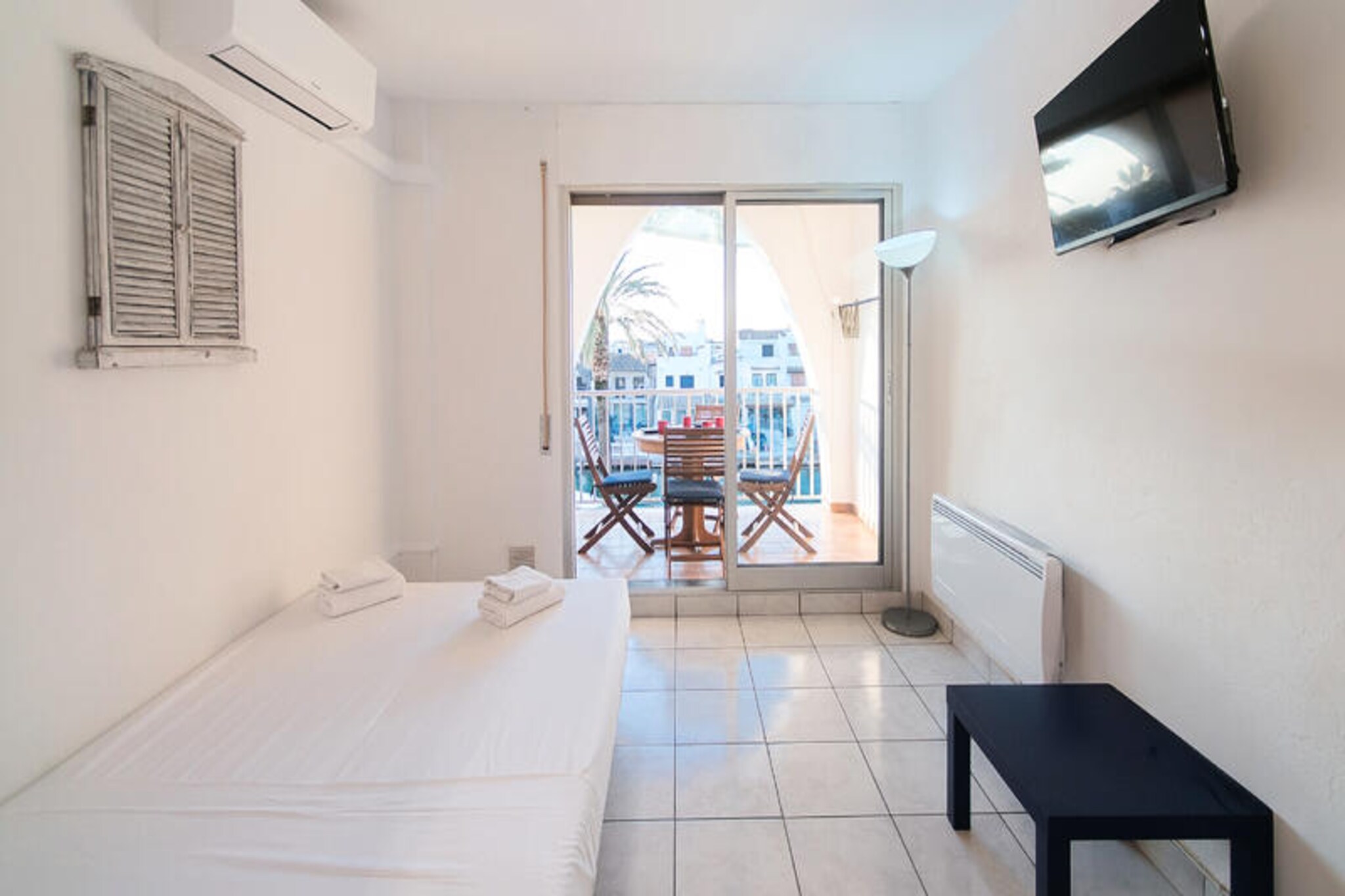 In the heart of the enchanting coastal village of Empuriabrava, this charming 22 m² studio on the second floor offers a serene retreat for two. Bathed in natural light streaming through large terrace windows, the studio boasts breathtaking views of the tranquil canal below. From the moment you step inside, you’ll feel the warmth and intimacy of this thoughtfully designed space, perfect for a romantic getaway or a peaceful escape. 
 
 The studio features a cozy double sofa at its center, inviting you to unwind and soak in the picturesque surroundings. Soft cushions and a plush blanket add a touch of homey comfort. The compact yet modern bathroom is equipped with a refreshing shower, ensuring a relaxing end to sun-soaked days. The kitchenette, though small, is fully equipped with everything you need to prepare delightful breakfasts or intimate dinners. The highlight of the studio is undoubtedly the private terrace, where you can sip your morning coffee as boats glide by or enjoy a glass of wine under the stars, serenaded by the gentle sounds of the water.
 
 Empuriabrava’s vibrant atmosphere is just steps away, with a variety of cafes and restaurants offering delicious local cuisine. Whether you’re strolling along the canals, exploring nearby beaches, or simply soaking up the Mediterranean charm, this studio places you at the heart of it all. 
 
 For those seeking tranquility and inspiration amidst nature and water, this cozy haven is the perfect choice. Let the beauty of Empuriabrava and the comfort of this studio create unforgettable memories.