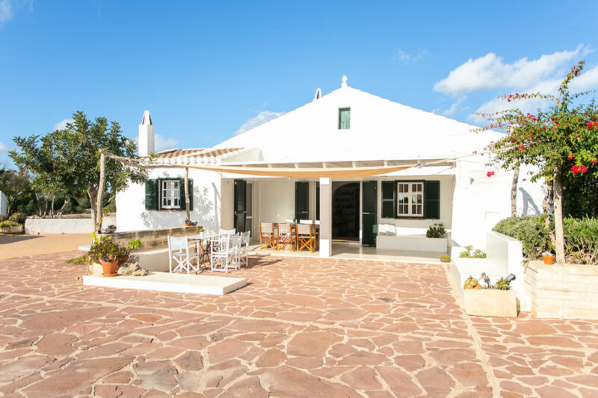 In the serene heart of Menorca, Finca Calafi Nou offers a luxurious escape where Mediterranean elegance meets modern comfort. This exclusive estate, surrounded by lush gardens and tranquil pine forests, invites you to immerse yourself in the island's natural beauty. Just a 10-minute drive from the pristine Cala Galdana beach, this finca is perfectly positioned for exploring all that Menorca has to offer while providing a peaceful retreat from the bustle of everyday life. Here, the gentle sounds of the countryside and the scent of the sea breeze create an atmosphere of pure relaxation. \n\nThe finca accommodates up to eight guests in four spacious bedrooms, two of which are en suite, all equipped with air conditioning for ultimate comfort. Three elegant bathrooms ensure privacy and convenience for all. The highlight of the property is its private pool, set within expansive gardens and separated by a security gate, making it a safe haven for families with children. The finca’s design seamlessly blends traditional Menorcan architecture with modern touches, creating a warm and inviting ambiance. Whether you’re lounging by the pool, enjoying a meal in the outdoor dining area, or unwinding in the cozy living spaces, every corner of this home is crafted for comfort and serenity.\n\nFinca Calafi Nou’s central location makes it an ideal base for exploring Menorca. From the picturesque beaches of Cala Galdana to charming villages and scenic trails, the island’s treasures are all within easy reach. The nearby Ferreries-Cala Galdana road ensures convenient access while maintaining the finca’s secluded feel. Guests can also enjoy the services of Sonne Villas, including on-site cleaning, maintenance, and a 24-hour emergency team, ensuring a seamless and worry-free stay.\n\nWhether you’re seeking a quiet retreat to reconnect with nature or a luxurious base to explore Menorca’s wonders, Finca Calafi Nou promises an unforgettable experience. Discover the magic of the island, create cherished memories with loved ones, and let this enchanting villa be your home away from home.