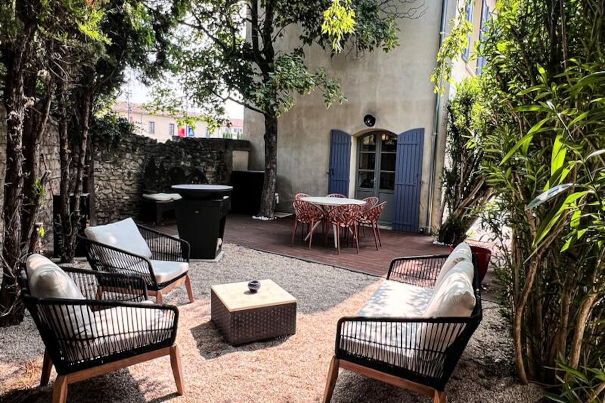In the heart of the enchanting L'Isle-sur-la-Sorgue, this elegant townhouse offers a perfect blend of Provençal charm and Art Deco sophistication, creating an unforgettable retreat in one of France's most picturesque regions. Just steps away from the historic center, you’ll find yourself immersed in a world of cobblestone streets, antique shops, and vibrant markets, where the essence of Provence comes alive. Whether you’re strolling along the canals or savoring the local cuisine, every moment here invites relaxation and discovery. Leave your car behind and enjoy the freedom of exploring this magical town on foot. 
 
 The property boasts a private, beautifully maintained outdoor space designed for memorable summer evenings. Gather around the fire pit under the starlit sky, unwind on the cozy garden furniture, or enjoy al fresco dining at the large outdoor table. The secure electric gate and private parking space ensure your peace of mind throughout your stay. 
 
 Inside, the ground floor welcomes you with a luminous living area featuring a comfortable lounge with a fireplace, perfect for cooler evenings, and a fully equipped kitchen with high-quality appliances and tableware. The adjoining dining area is ideal for sharing meals in a warm and inviting atmosphere. Upstairs, three tastefully decorated bedrooms await, including a luxurious master suite with a freestanding bathtub and serene ambiance. Two additional bedrooms, bright and elegantly furnished, offer ample storage and comfort. A modern bathroom with a walk-in shower completes the upper floor. 
 
 Perfectly situated for exploring Provence, the house is just 15 minutes from the Alpilles and the hilltop villages of the Luberon, 10 minutes from Fontaine-de-Vaucluse, and 45 minutes from the beaches of the Côte Bleue. Nearby activities include golf, kayaking on the Sorgue River, wine tasting, hiking, and cycling. With Avignon TGV station only 30 minutes away and Marseille-Provence airport 40 minutes away, this property is an ideal base for an unforgettable Provençal getaway.