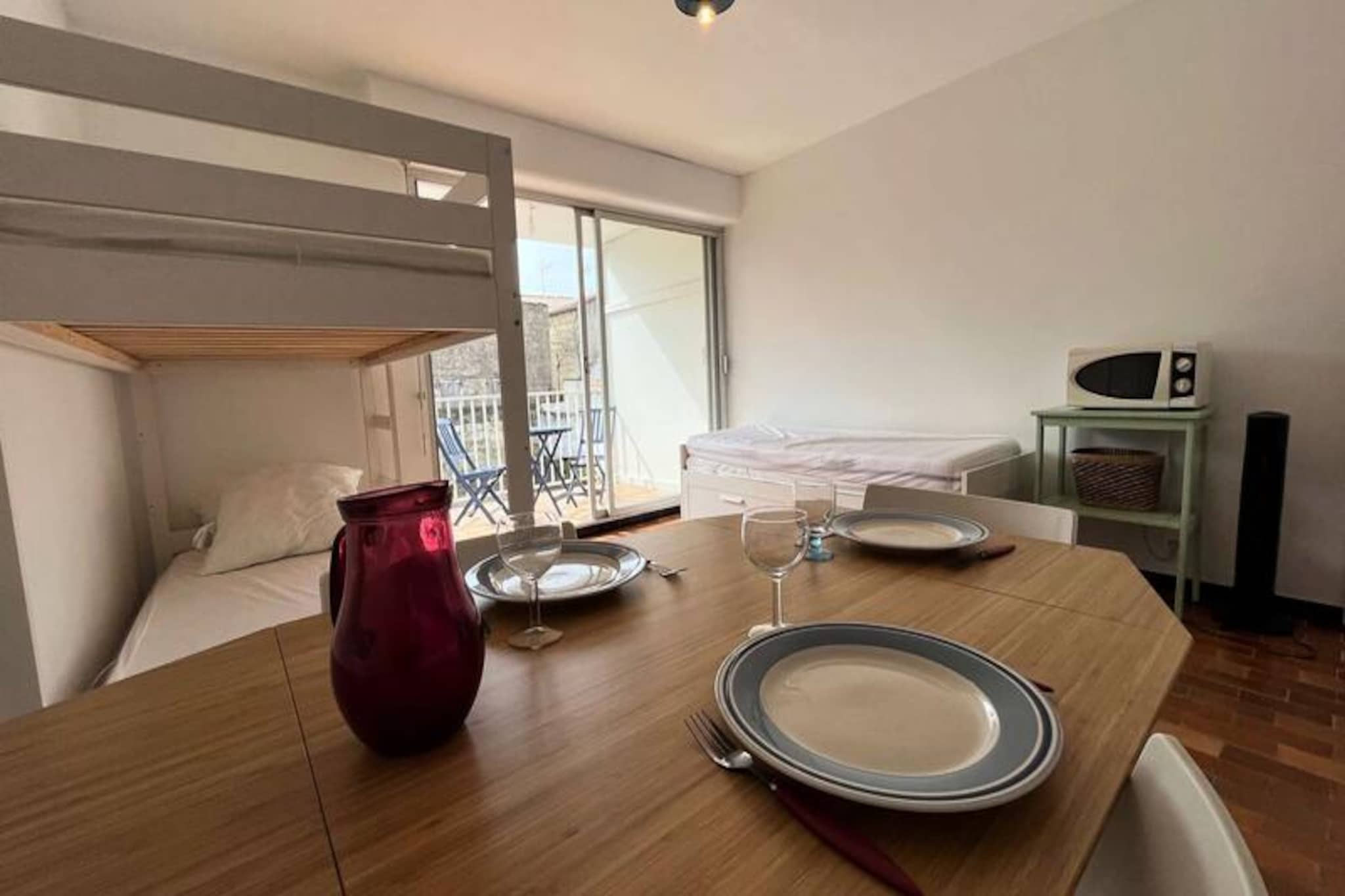 In the vibrant heart of Grau-du-Roi, where the Mediterranean breeze mingles with the charm of a seaside town, this cozy apartment offers an inviting retreat for your next holiday. Whether you’re seeking sun-soaked beaches or exploring the marina’s lively atmosphere, this property places you at the center of it all, promising a memorable stay filled with relaxation and adventure. Imagine waking up to the gentle hum of the town and stepping out to discover the treasures of the French Riviera just moments away. \n\nThis thoughtfully designed 24m² apartment comfortably accommodates up to four guests, making it ideal for couples, families, or small groups. The functional kitchen is perfect for preparing fresh meals after a day of exploring, while the furnished terrace invites you to unwind with a glass of local wine under the evening sky. With bunk beds and a sofa bed, the sleeping arrangements are both practical and cozy. A private parking space within the residence ensures convenience throughout your stay. \n\nLocated just steps from shops, restaurants, and the golden sands of Grau-du-Roi beach, you’ll find everything you need within walking distance. For family fun, the amusement park near Espiguette Beach is just 3km away, while the renowned Seaquarium offers year-round entertainment for visitors of all ages. Outdoor enthusiasts can enjoy horseback riding along scenic trails or embark on a boat trip to explore the region’s stunning coastline. \n\nWhether you’re here to bask in the sun, savor fresh seafood, or immerse yourself in local culture, this apartment is your gateway to the best of Grau-du-Roi. Create unforgettable memories in this charming seaside haven, where every moment feels like a celebration of the Mediterranean lifestyle.