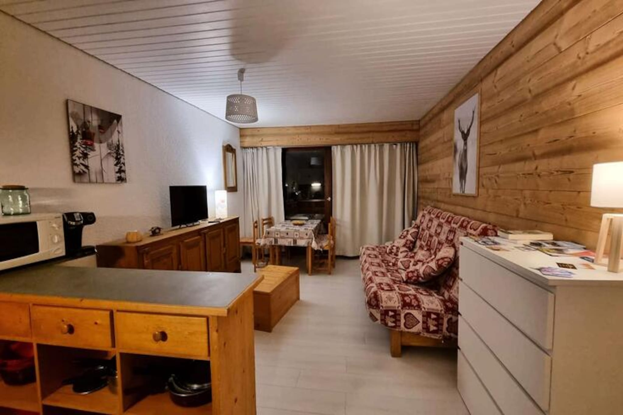 High above the picturesque Les Deux Alpes, this cozy studio apartment on the 4th floor offers a serene escape with breathtaking views of the majestic Muzelle mountain. Imagine unwinding on your private south-facing balcony, watching the torchlight descent illuminate the slopes on festive evenings. This charming 28 m² retreat is the perfect haven for families or friends seeking a memorable alpine getaway. \n\nDesigned to comfortably accommodate up to four guests, the apartment features a mountain-style alcove with bunk beds, a welcoming living room with a sofa bed, and a bathroom complete with a bathtub and hairdryer. The separate toilet and fully equipped open kitchen – boasting an oven, microwave, dishwasher, and even a raclette grill – ensure all the comforts of home. Practical amenities like private parking, secure ski storage, and Wi-Fi make your stay effortless, while a nearby free shuttle and the 3S ski lifts, just a 3-minute walk away, provide seamless access to the slopes. \n\nLes Deux Alpes is a year-round paradise. In winter, explore 225 km of ski slopes, a world-class snowpark, and the iconic La Grave off-piste area. Summer transforms the resort into a vibrant hub for panoramic hikes, mountain biking in one of Europe’s largest bike parks, paragliding, and even golf. With lively bars, restaurants, and cultural events, the resort buzzes with energy in every season. \n\nWhether you’re seeking thrilling adventures or tranquil moments in nature, this delightful apartment places you at the heart of it all. Book now and let the magic of Les Deux Alpes captivate you!