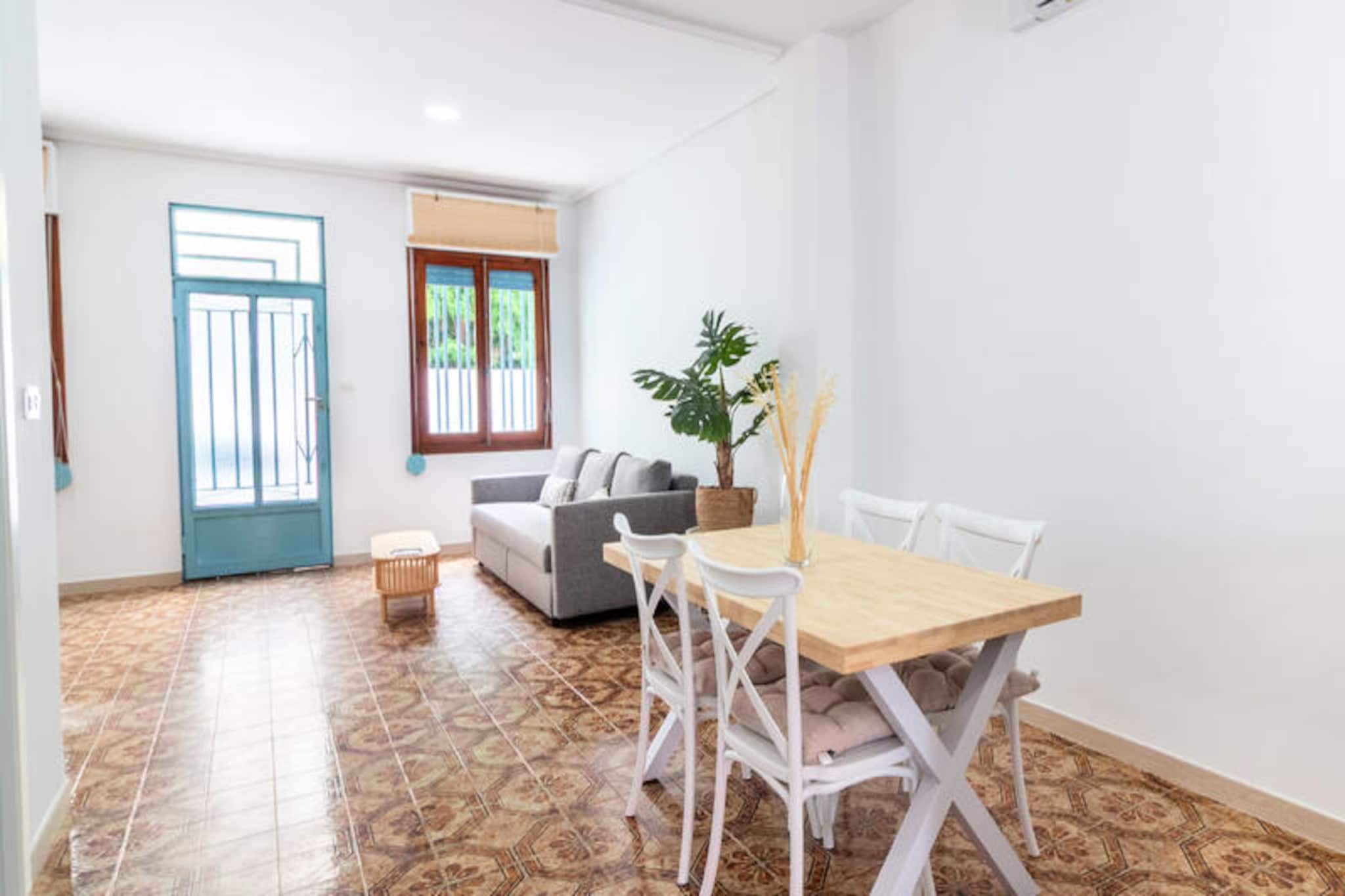 In the charming coastal town of Moncófar, where the Mediterranean breeze whispers through the palm trees, Villa Magdalena offers a serene escape for couples and small groups. This inviting retreat, just a short stroll from the golden sands, is the perfect setting for those seeking relaxation and comfort in a picturesque Spanish setting. Imagine waking up to the soft glow of the sun, enjoying your morning coffee on the terrace, and planning a day filled with seaside adventures or tranquil moments by the shore. 
 
 The villa spans 101 square meters, thoughtfully designed to accommodate up to six guests. Inside, you’ll find two cozy bedrooms that promise restful nights, a modern bathroom with a refreshing shower, and a fully equipped open-plan kitchen featuring an oven, microwave, coffee maker, toaster, and juicer. The air-conditioned living room ensures a cool retreat during the warmest days, while additional amenities like a television, heat pump heating, and an iron add to the convenience of your stay. Every detail has been curated to provide a seamless experience, making it an ideal choice for families or friends. 
 
 Moncófar’s vibrant surroundings offer plenty to explore. From the nearby beaches to charming local markets and authentic Spanish eateries, there’s something for everyone. Whether you’re indulging in fresh seafood, strolling along the promenade, or simply soaking in the Mediterranean sun, the villa’s location ensures you’re never far from the action. For those seeking a quieter pace, the peaceful ambiance of the villa provides the perfect sanctuary. 
 
 Villa Magdalena is more than just a place to stay; it’s a gateway to unforgettable memories. With flexible check-in times and a commitment to a family-friendly atmosphere, this property invites you to experience the best of Moncófar in comfort and style.