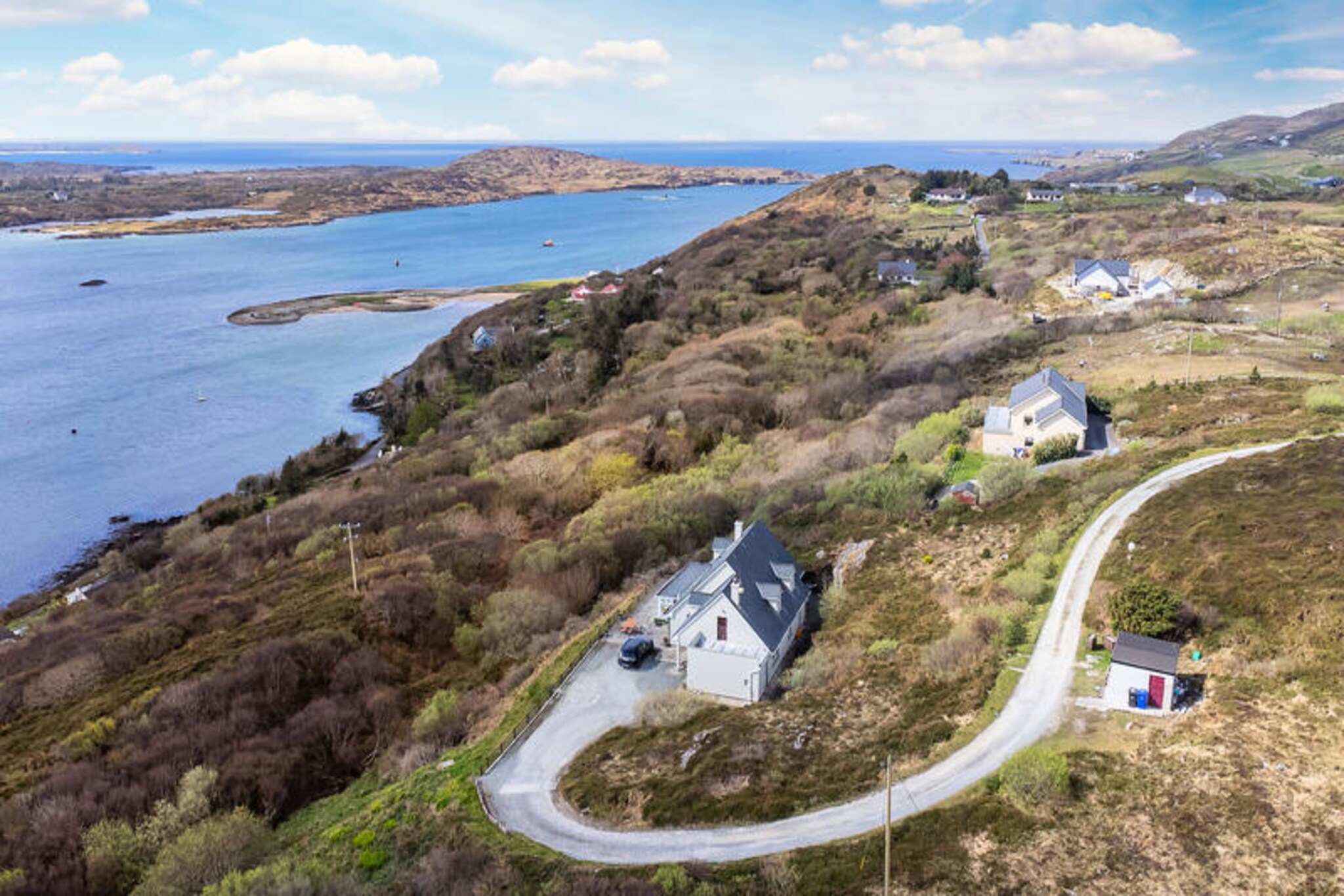 Overlooking the rugged beauty of Connemara, this spacious home in Clifden offers a serene retreat with breathtaking sea and mountain views. Imagine waking up to the tranquil sounds of nature, with the Atlantic breeze gently sweeping through the air, and enjoying your morning coffee while gazing out at the ever-changing Irish skies. This is a place where the wild charm of Ireland meets the comforts of a well-appointed home. 

With 260 m² of space, this property comfortably accommodates up to nine guests across three inviting bedrooms. The house is thoughtfully designed for relaxation and convenience, featuring a cozy fireplace, central heating, and three televisions for entertainment. The fully equipped kitchen, complete with modern appliances such as a dishwasher, coffee maker, and microwave, makes preparing meals a pleasure. Outside, the garden furniture and barbecue invite you to savor alfresco dining while soaking in the stunning surroundings. Additional amenities like a washing machine, tumble dryer, and Wi-Fi ensure a seamless stay.

Situated just 2 km from Clifden town, you’re perfectly positioned to explore the vibrant local scene. From charming pubs like Guys Bar to the fresh seafood at Mannions, there’s something for every palate. For outdoor enthusiasts, the nearby beaches of Eyrephort and Coral Strand offer pristine sands and crystal-clear waters, while Connemara National Park, just 15 km away, is a haven for hikers and nature lovers. Golfers will appreciate the proximity to Connemara Golf Links, and history buffs can explore the rich heritage of the region.

Whether you’re seeking adventure or a peaceful escape, this Clifden home is your gateway to the unspoiled beauty of Ireland’s west coast. Create unforgettable memories in a setting that feels like a world away, yet offers all the comforts of home.