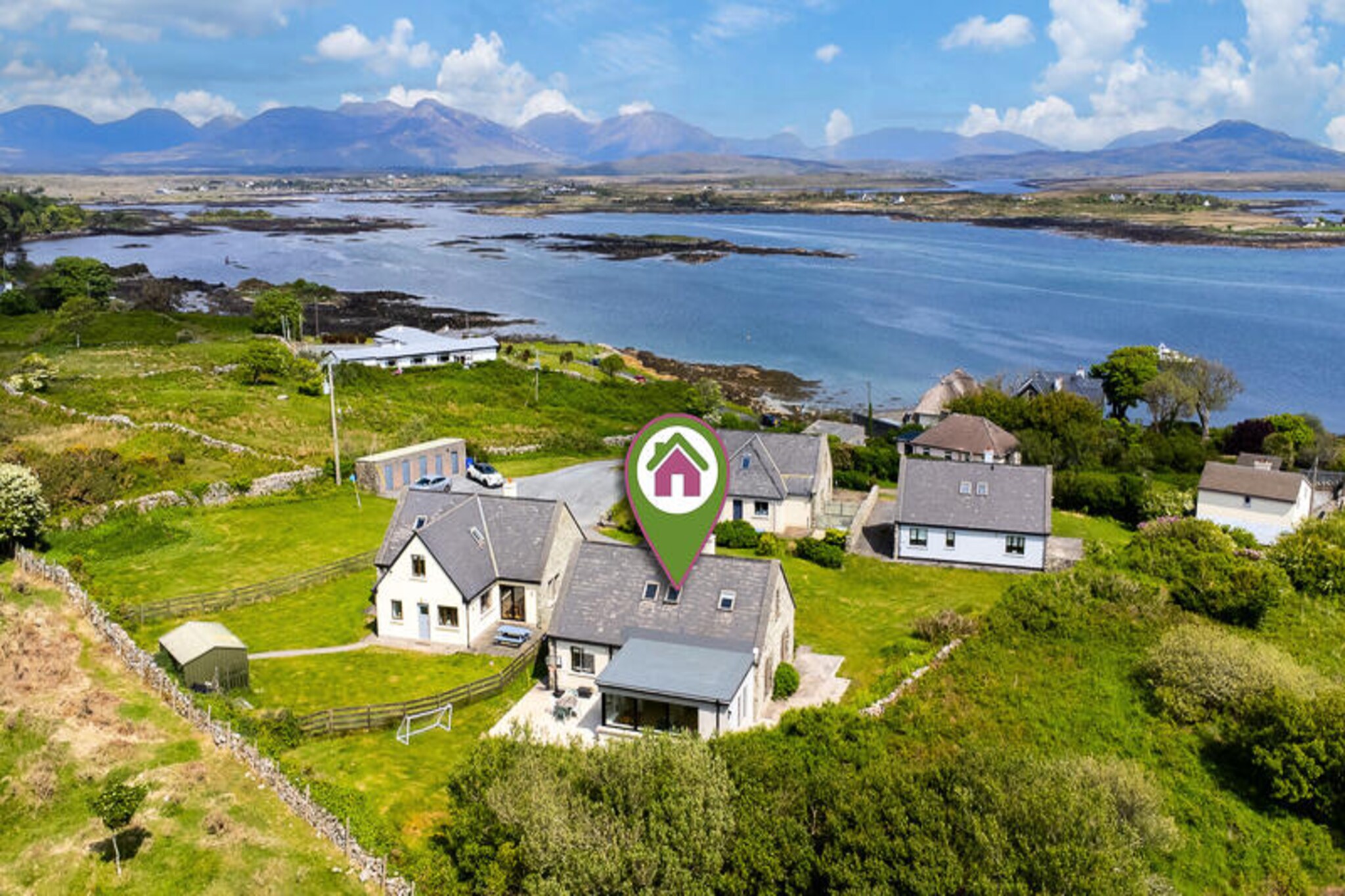On the rugged shores of Roundstone, where the Atlantic breeze whispers through the wild Connemara landscape, this charming coastal house invites you to experience Ireland’s untamed beauty. Surrounded by rolling hills and shimmering waters, it’s a haven for those seeking tranquility and adventure in equal measure. Wake up to the soothing sounds of nature and let the breathtaking views inspire your day. Whether you’re exploring nearby beaches or simply unwinding in the garden, this property offers a slice of serenity like no other. \n\nInside, the house boasts four cozy bedrooms, comfortably accommodating up to eight guests. The open-plan kitchen is fully equipped with modern appliances, including a refrigerator, oven, microwave, and more, making it easy to prepare hearty meals after a day of exploration. The living spaces are warm and inviting, with Wi-Fi and electric heating ensuring comfort year-round. Additional amenities such as a washing machine, dryer, and hairdryer add convenience to your stay, while the on-site parking makes it easy to venture out and explore the surrounding area. \n\nRoundstone is a gateway to Connemara’s treasures. Stroll along the picturesque harbor, visit local artisan shops, or enjoy fresh seafood in one of the village’s renowned restaurants. Nearby, you’ll find pristine beaches, hiking trails, and the iconic Twelve Bens mountain range, perfect for outdoor enthusiasts. The area is rich in history and culture, offering countless opportunities to immerse yourself in Ireland’s heritage. \n\nWhether you’re seeking a peaceful retreat or an active holiday, this Roundstone property is your perfect base for creating unforgettable memories in the heart of Connemara.
