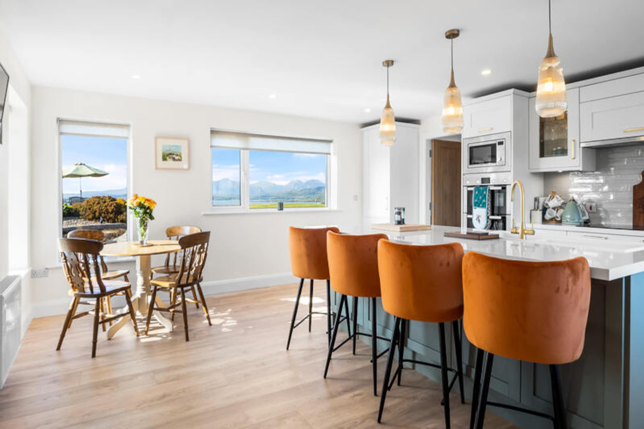 In the heart of Ireland’s rugged Connemara region, this charming house in Cashel offers a serene escape surrounded by breathtaking landscapes of rolling hills, sparkling beaches, and tranquil countryside. Whether you’re seeking a peaceful retreat or an adventure-filled getaway, this property provides the perfect base to explore the natural beauty and cultural richness of the area. Imagine waking up to the sound of birdsong and stepping outside to enjoy the fresh Atlantic breeze. \n\nSpanning 148 square meters, the house comfortably accommodates up to seven guests across three spacious bedrooms, making it ideal for families or groups of friends. The American-style kitchen is fully equipped with modern appliances, including a refrigerator, oven, dishwasher, and more, ensuring you can prepare delicious meals with ease. The cozy living spaces feature two televisions, Wi-Fi, and central heating, creating a warm and inviting atmosphere for relaxing evenings. Additional amenities such as a washing machine, tumble dryer, and on-site parking add to the convenience of your stay. \n\nThe property is perfectly situated to explore the region’s highlights. Just 28 meters away lies Trá na Feadóige, a beautiful sandy beach, while other stunning beaches like Moyrus Beach, Dog’s Bay, and Gurteen Beach are within easy reach. Nearby towns such as Carna, Roundstone, and Clifden offer charming shops, traditional pubs, and local markets. For golf enthusiasts, the renowned Connemara Golf Links is a short drive away, and nature lovers will delight in the scenic trails and wildlife of the Connemara National Park. \n\nWhether you’re strolling along pristine beaches, savoring fresh seafood at a local eatery, or simply unwinding in the comfort of this well-appointed home, your stay in Cashel promises unforgettable memories. Discover the magic of Connemara and let the beauty of Ireland captivate your heart.