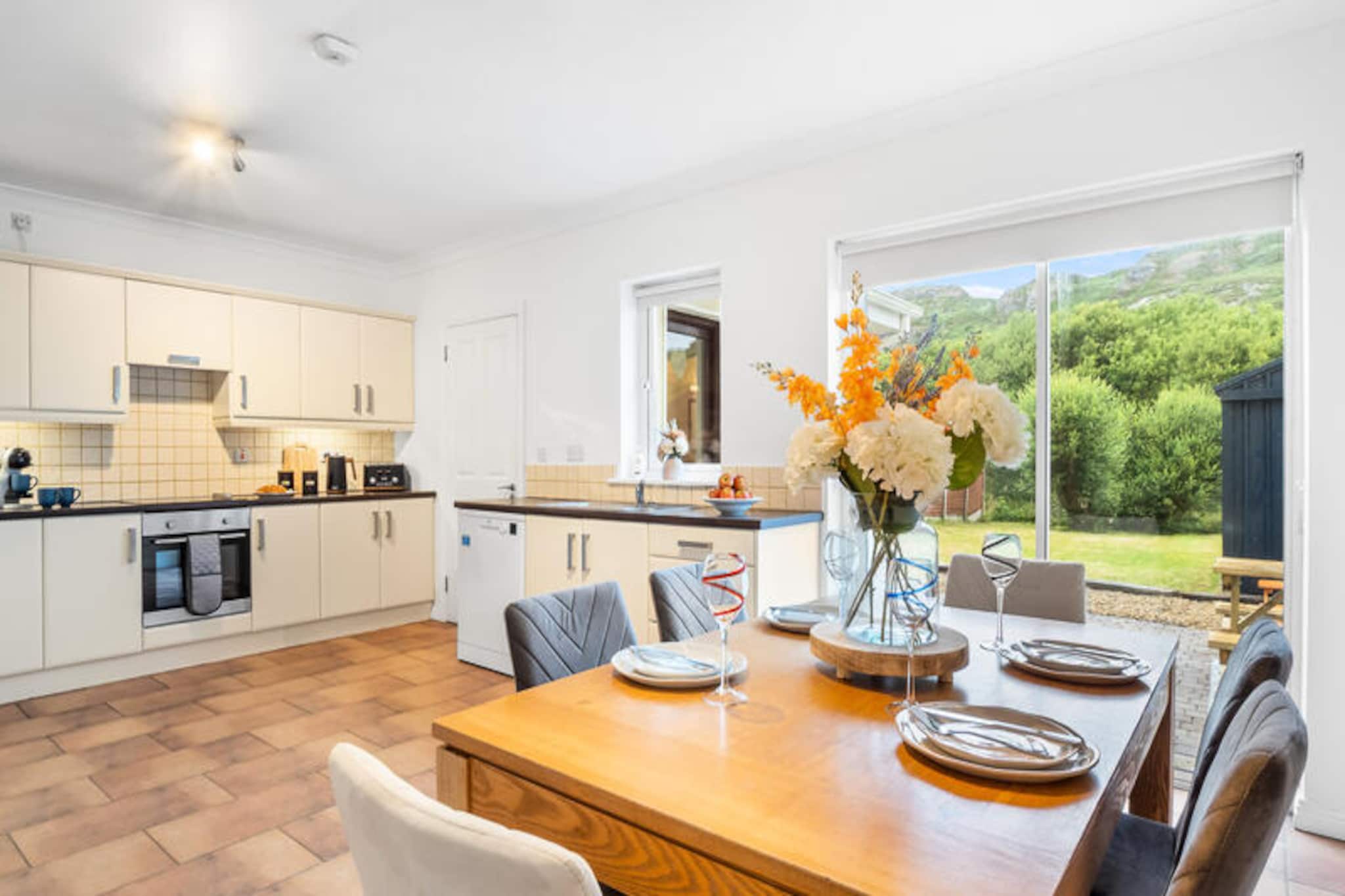 In the heart of Connemara's rugged beauty, this charming Clifden home offers a serene retreat surrounded by breathtaking landscapes and vibrant local culture. Whether you're seeking a tranquil escape or an adventure-filled getaway, this property provides the perfect base to experience the magic of Ireland's west coast. Imagine waking up to the soft whispers of the Atlantic breeze and enjoying your morning coffee in the lush garden, immersed in the peaceful ambiance of the countryside. 

Spanning 116 m², this spacious home comfortably accommodates up to six guests across four cozy bedrooms. The separate kitchen is fully equipped with modern appliances, including a refrigerator, oven, microwave, and dishwasher, making it easy to prepare delicious meals with fresh local ingredients. Relax in the inviting living area with two televisions and Wi-Fi, or enjoy a barbecue in the garden with family and friends. Additional amenities such as a washing machine, dryer, and central heating ensure a comfortable and convenient stay year-round.

Located just 850 meters from Clifden Town, you'll find an array of charming cafes, restaurants, and pubs, including Signal Bar & Restaurant and Mannions Seafood Bar. Explore the nearby Salt Lake, or take a short drive to the stunning Eyrephort Beach, just 9 km away. For outdoor enthusiasts, the Connemara National Park and the renowned Connemara Golf Links are within 15 km, offering endless opportunities for hiking, wildlife spotting, and golfing. Further afield, the pristine sands of Dogs Bay and Glassilaun Beach await, perfect for a day of relaxation by the sea.

Whether you're drawn by the allure of Connemara's wild landscapes, the warmth of its local hospitality, or the rich cultural heritage of Clifden, this home promises an unforgettable Irish holiday experience. Book your stay and create memories that will last a lifetime.